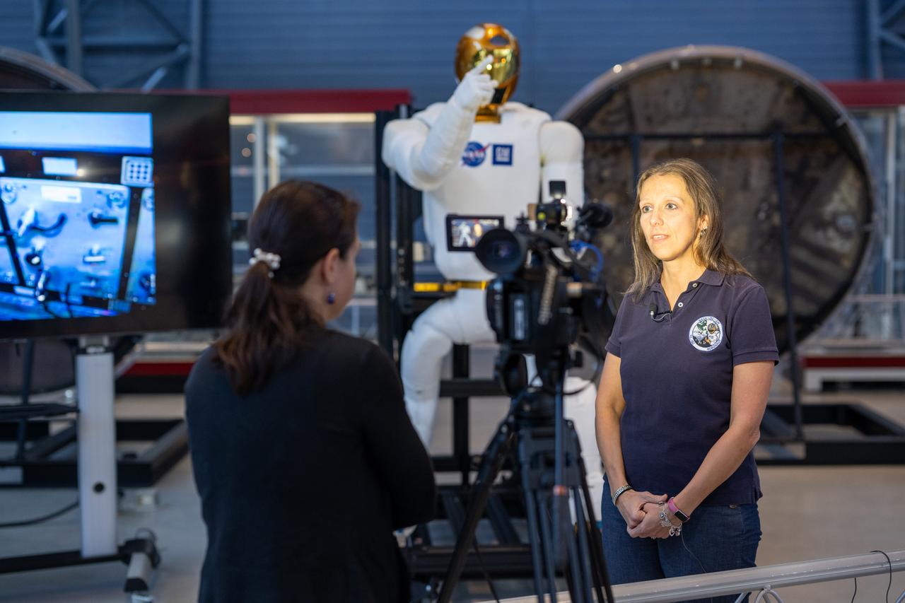 Julia Badger, autonomy and vehicle systems manager for Gateway at NASA’s Johnson Space Center and former Robonaut project manager, participates in a media opportunity at the Smithsonian National Air and Space Museum’s Steve F. Udvar-Hazy Center Thursday, Oct. 24, 2024, in Chantilly, Va. Robonaut 2, the first humanoid robot to fly to space, is displayed publicly for the first time near the space shuttle Discovery. Photo Credit: (NASA/Keegan Barber)