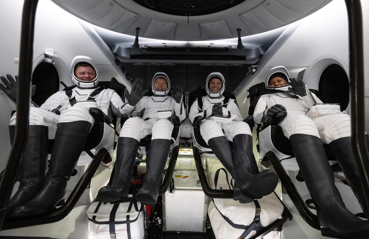 Roscosmos cosmonaut Alexander Grebenkin, left, NASA astronauts Michael Barratt, second from left, Matthew Dominick, second from right, and Jeanette Epps, right are seen inside the SpaceX Dragon Endeavour spacecraft onboard the SpaceX recovery ship MEGAN shortly after having landed in the Gulf of Mexico off the coast of Pensacola, Florida, Friday, Oct. 25, 2024. Dominick, Barratt, Epps, Grebenkin are returning after seven-months in space as part of Expedition 70 aboard the International Space Station. Photo Credit: (NASA/Joel Kowsky)