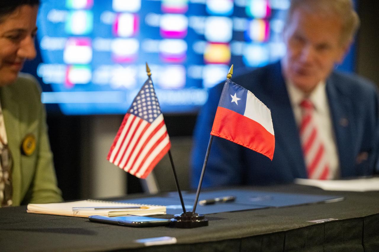 The flags of the United States and Chile are seen during an Artemis Accords signing ceremony Friday, Oct. 25, 2024, at the Mary W. Jackson NASA Headquarters building in Washington. The Republic of Chile is the 47th country to sign the Artemis Accords, which establish a practical set of principles to guide space exploration cooperation among nations participating in NASA’s Artemis program. Photo Credit: (NASA/Keegan Barber)