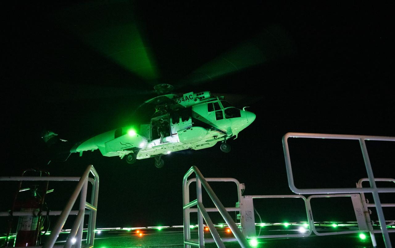 The helicopter that will carry NASA astronauts Matthew Dominick, Michael Barratt, and Jeanette Epps, and Roscosmos cosmonaut Alexander Grebenkin is seen as it lands on the SpaceX recovery ship MEGAN in the Gulf of Mexico off the coast of Pensacola, Florida, Friday, Oct. 25, 2024. Dominick, Barratt, Epps, Grebenkin are returning after seven-months in space as part of Expedition 71 aboard the International Space Station. Photo Credit: (NASA/Joel Kowsky)