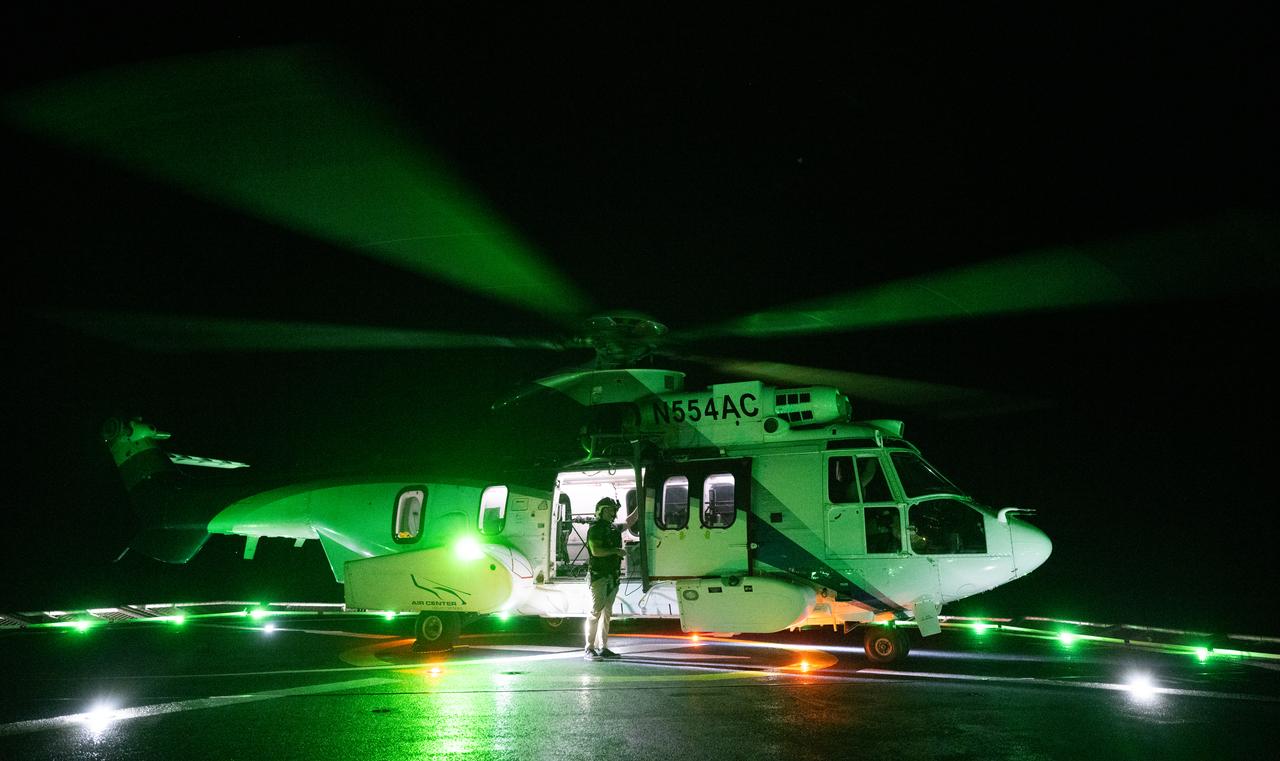 The helicopter that will carry NASA astronauts Matthew Dominick, Michael Barratt, and Jeanette Epps, and Roscosmos cosmonaut Alexander Grebenkin is seen on the helideck of the SpaceX recovery ship MEGAN in the Gulf of Mexico off the coast of Pensacola, Florida, Friday, Oct. 25, 2024. Dominick, Barratt, Epps, Grebenkin are returning after seven-months in space as part of Expedition 71 aboard the International Space Station. Photo Credit: (NASA/Joel Kowsky)