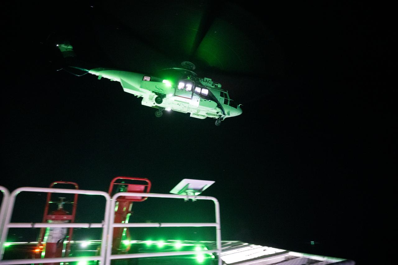 The helicopter carrying NASA astronauts Matthew Dominick, Michael Barratt, and Jeanette Epps, and Roscosmos cosmonaut Alexander Grebenkin is seen as it lands on the SpaceX recovery ship MEGAN in the Gulf of Mexico off the coast of Pensacola, Florida, Friday, Oct. 25, 2024. Dominick, Barratt, Epps, Grebenkin are returning after seven-months in space as part of Expedition 71 aboard the International Space Station. Photo Credit: (NASA/Joel Kowsky)