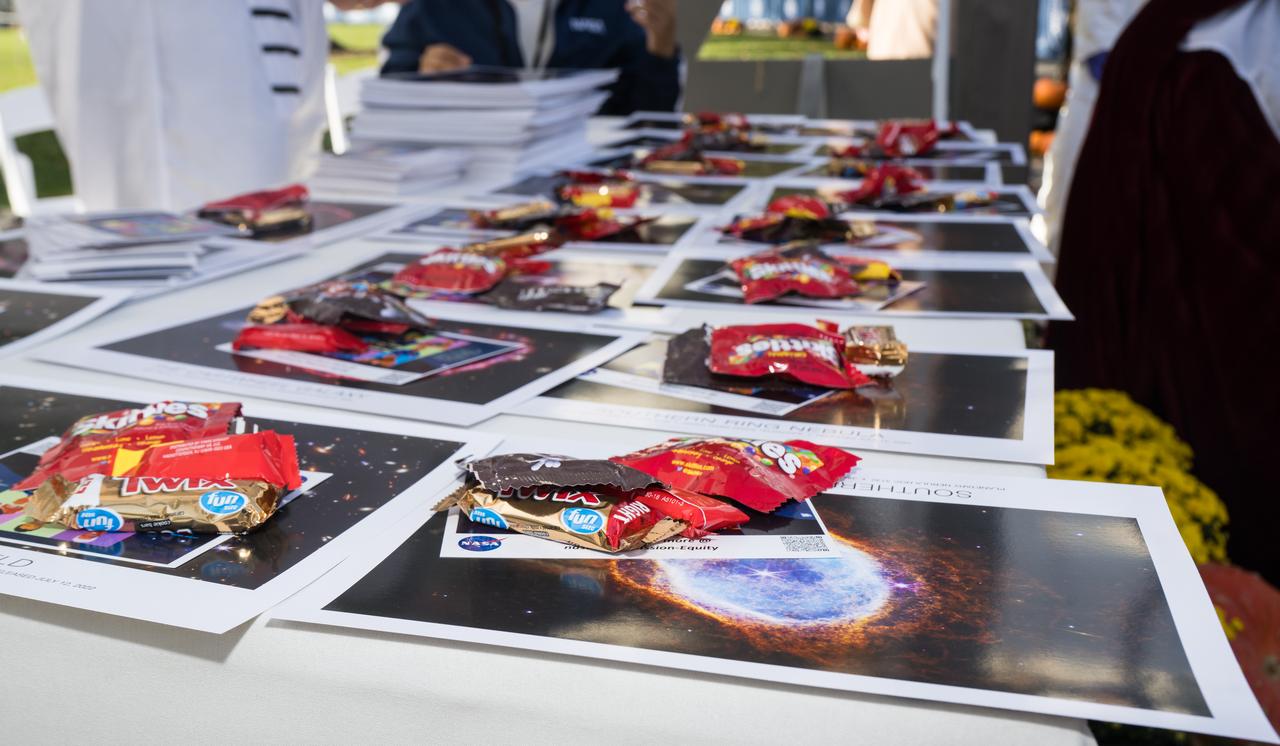 NASA handouts and candy is seen at a White House Halloween themed event titled, “Hallo-READ!” on Wednesday, Oct. 30, 2024 on the south lawn of the White House in Washington. Photo Credit: (NASA/Aubrey Gemignani)