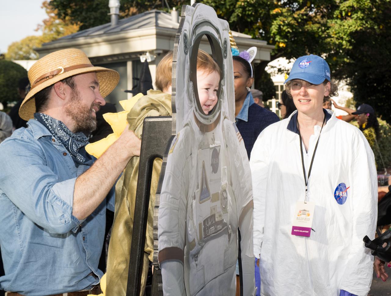 A visitor poses for a photo at a White House Halloween themed event titled, “Hallo-READ!” on Wednesday, Oct. 30, 2024 on the south lawn of the White House in Washington. Photo Credit: (NASA/Aubrey Gemignani)