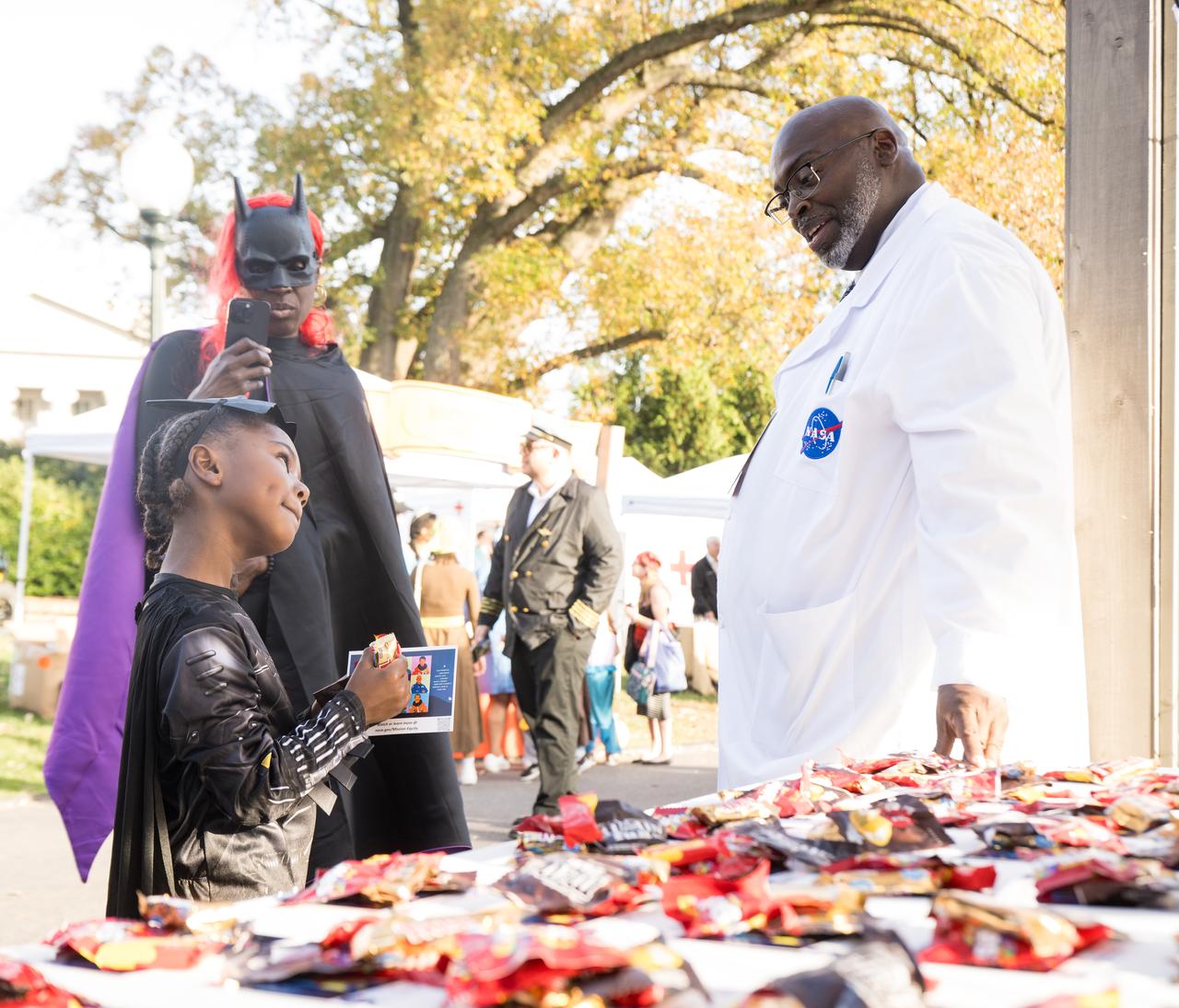 NASA staff hand out candy at a White House Halloween themed event titled, “Hallo-READ!” on Wednesday, Oct. 30, 2024 on the south lawn of the White House in Washington. Photo Credit: (NASA/Aubrey Gemignani)
