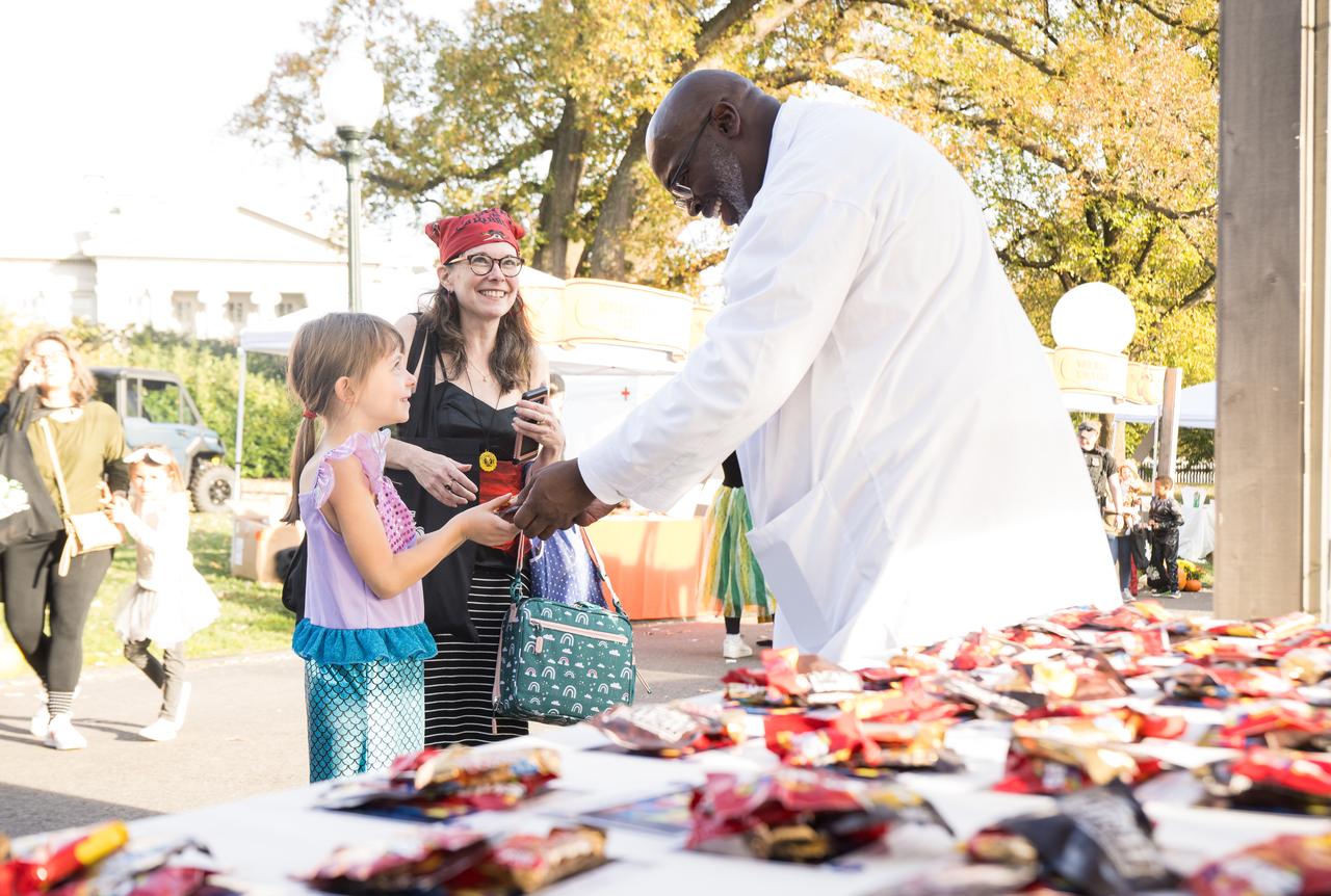 NASA staff hand out candy at a White House Halloween themed event titled, “Hallo-READ!” on Wednesday, Oct. 30, 2024 on the south lawn of the White House in Washington. Photo Credit: (NASA/Aubrey Gemignani)