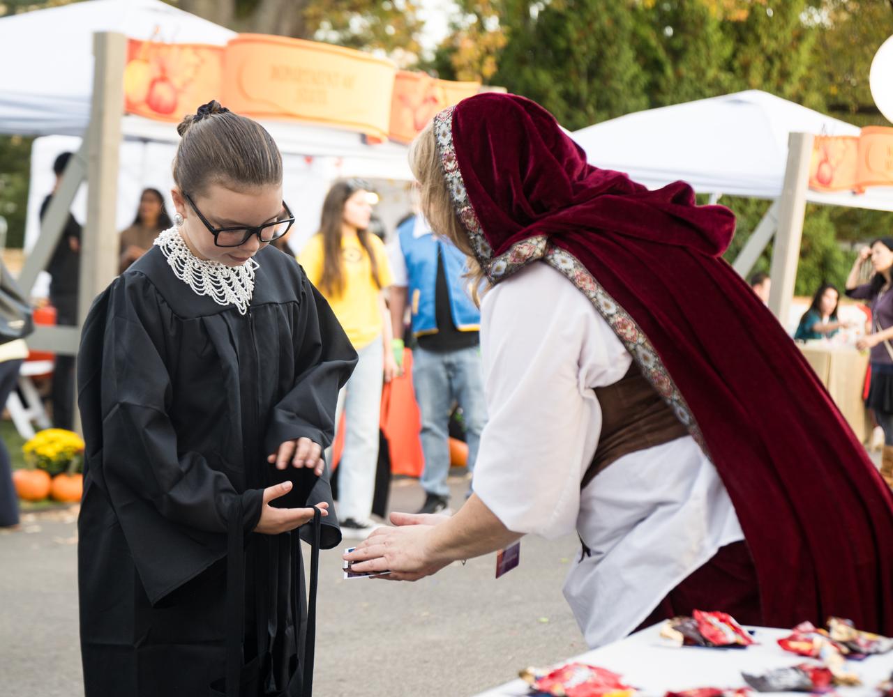 NASA staff hand out candy at a White House Halloween themed event titled, “Hallo-READ!” on Wednesday, Oct. 30, 2024 on the south lawn of the White House in Washington. Photo Credit: (NASA/Aubrey Gemignani)