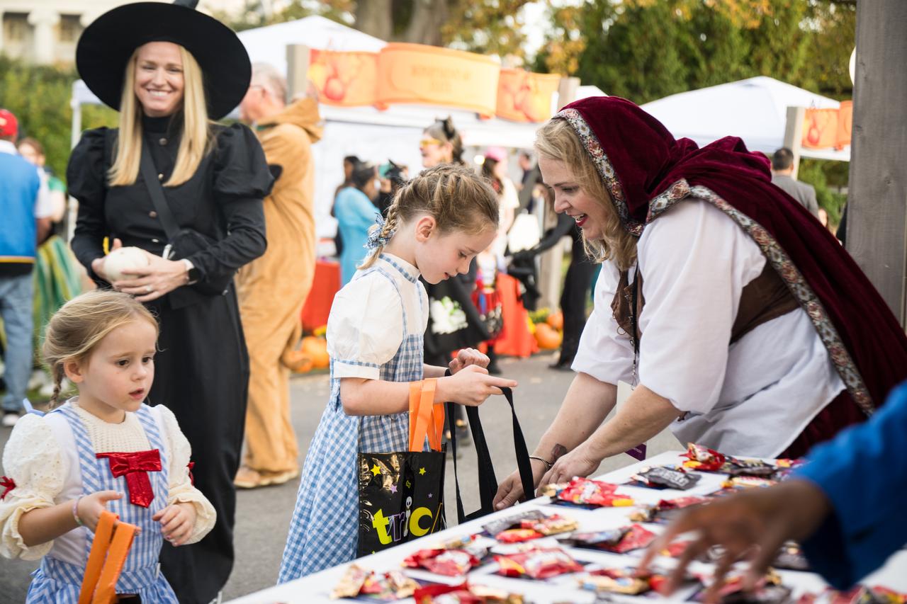 NASA staff hand out candy at a White House Halloween themed event titled, “Hallo-READ!” on Wednesday, Oct. 30, 2024 on the south lawn of the White House in Washington. Photo Credit: (NASA/Aubrey Gemignani)