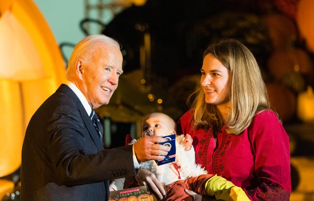 U.S. President Joe Biden hands out candy at a White House Halloween themed event titled, “Hallo-READ!” on Wednesday, Oct. 30, 2024 on the south lawn of the White House in Washington. Photo Credit: (NASA/Aubrey Gemignani)