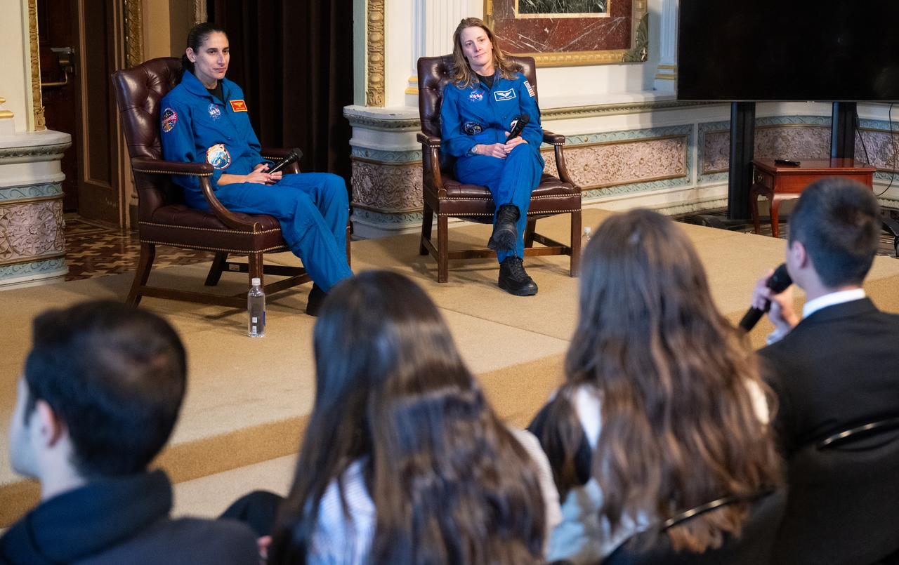 NASA astronauts Jasmin Moghbeli, left, and Loral O’Hara, right, listen to a question during a fireside chat, Wednesday, Dec. 4, 2024 at the Eisenhower Executive Office Building in Washington. O’Hara and Moghbeli spent six months in space as part of Expedition 70 aboard the International Space Station.  Photo Credit: (NASA/Joel Kowsky)