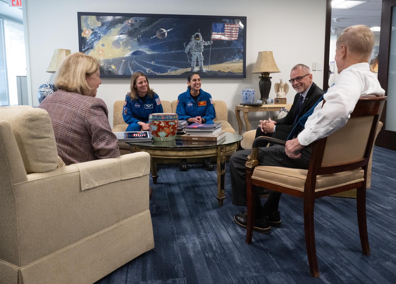 NASA astronauts Loral O’Hara, second from left, and Jasmin Moghbeli, center, meet with NASA Deputy Administrator Pam Melroy, left, and NASA Associate Administrator Jim Free, second from right, and NASA Administrator Bill Nelson, right, Wednesday, Dec. 4, 2024, at the Mary W. Jackson NASA Headquarters Building in Washington. O’Hara and Moghbeli spent six months in space as part of Expedition 70 aboard the International Space Station.  Photo Credit: (NASA/Joel Kowsky)