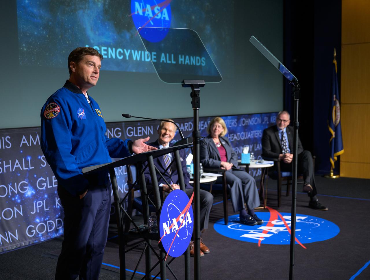 NASA Astronaut and Artemis II commander Reid Wiseman, gives remarks during a NASA agencywide all hands, as NASA Administrator Bill Nelson, NASA Deputy Administrator Pam Melroy, and, NASA Associate Administrator Jim Free, right, look on, Friday, Dec. 6, 2024, at the NASA Headquarters Mary W. Jackson Building in Washington. Photo Credit: (NASA/Bill Ingalls)
