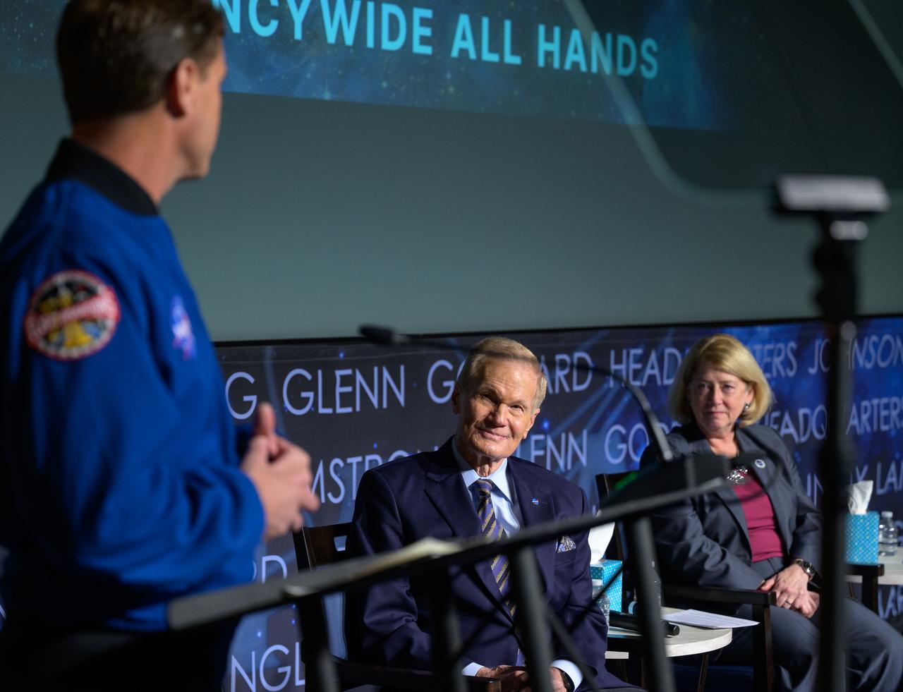 NASA Astronaut and Artemis II commander Reid Wiseman, gives remarks during a NASA agencywide all hands, as NASA Administrator Bill Nelson, NASA Deputy Administrator Pam Melroy,  right, look on, Friday, Dec. 6, 2024, at the NASA Headquarters Mary W. Jackson Building in Washington. Photo Credit: (NASA/Bill Ingalls)