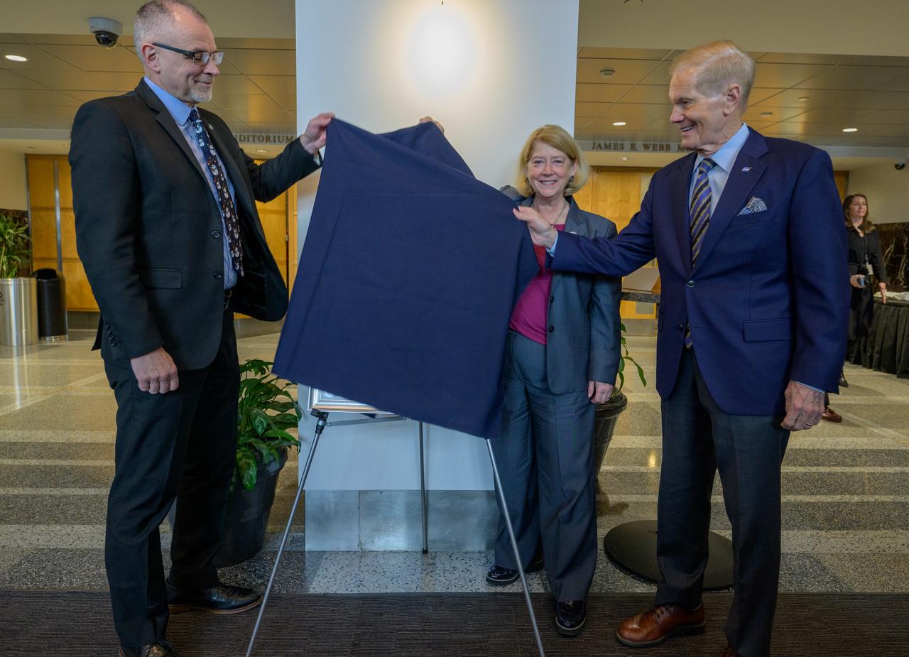 A portrait of Mary W. Jackson is unveiled, by NASA Associate Administrator Jim Free, left, NASA Deputy Administrator Pam Melroy, and, NASA Administrator Bill Nelson, right, Friday, Dec. 6, 2024, at the NASA Headquarters Mary W. Jackson Building in Washington. Mary W. Jackson was a pioneering aerospace engineer and mathematician at NASA’s Langley Research Center. As one of the “Hidden Figures,” she made significant contributions to the space program, particularly in aerodynamics and engineering. Jackson’s groundbreaking work and advocacy for women and minorities helped shape NASA’s success and advance opportunities for future generations in science and technology. Photo Credit: (NASA/Bill Ingalls)