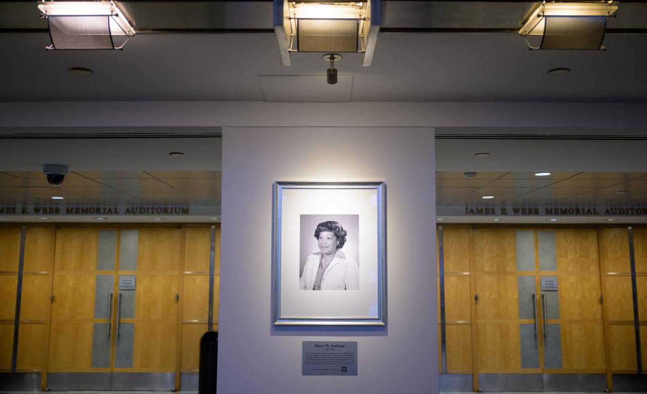 A portrait of Mary W. Jackson is seen after it was unveiled, Friday, Dec. 6, 2024, at the NASA Headquarters Mary W. Jackson Building in Washington. Mary W. Jackson was a pioneering aerospace engineer and mathematician at NASA’s Langley Research Center. As one of the “Hidden Figures,” she made significant contributions to the space program, particularly in aerodynamics and engineering. Jackson’s groundbreaking work and advocacy for women and minorities helped shape NASA’s success and advance opportunities for future generations in science and technology. Photo Credit: (NASA/Joel Kowsky)