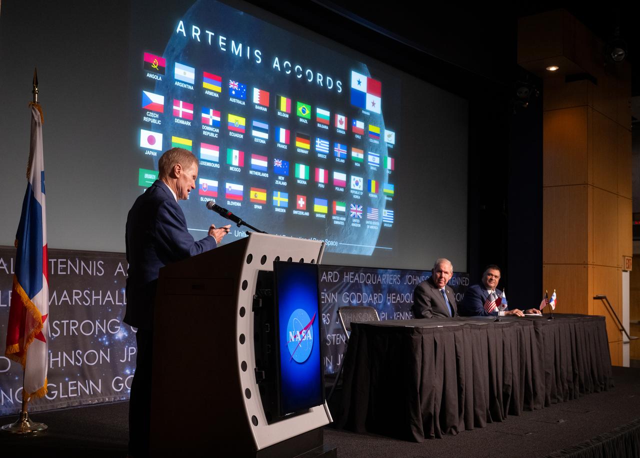 NASA Administrator Bill Nelson delivers remarks as Ambassador of the Republic of Panama to the United States of America José Miguel Alemán, center, and U.S. Department of State Principal Deputy Assistant Secretary in the Bureau of Oceans and International Environmental and Scientific Affairs Tony Fernandes look on during an Artemis Accords signing ceremony, Wednesday, Dec. 11, 2024, at the Mary W. Jackson NASA Headquarters building in Washington. The Republic of Armenia is the 49th country to sign the Artemis Accords, which establish a practical set of principles to guide space exploration cooperation among nations participating in NASA’s Artemis program. Photo Credit: (NASA/Joel Kowsky)