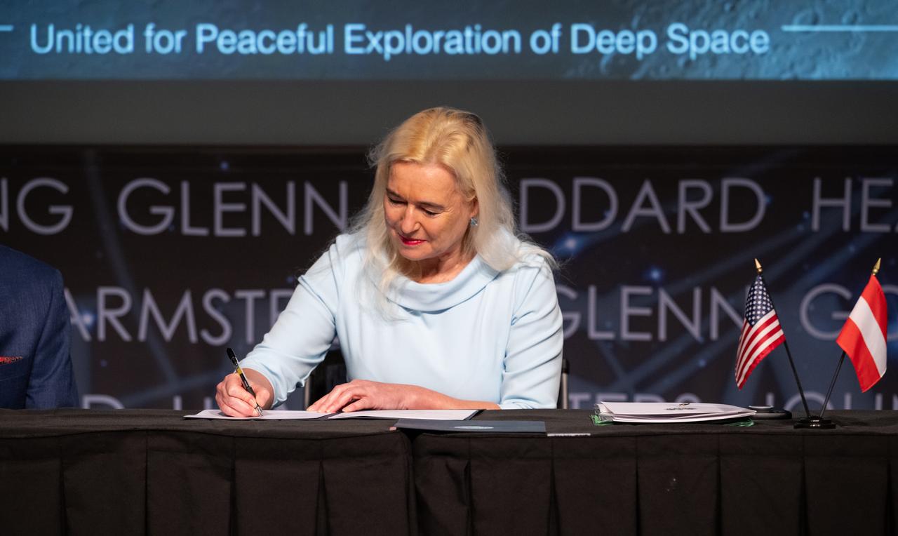 Ambassador of the Republic of Austria to the United States of America Petra Schneebauer, signs the Artemis Accords, Wednesday, Dec. 11, 2024, at the Mary W. Jackson NASA Headquarters building in Washington. The Republic of Austria is the 50th country to sign the Artemis Accords, which establish a practical set of principles to guide space exploration cooperation among nations participating in NASA’s Artemis program. Photo Credit: (NASA/Joel Kowsky)