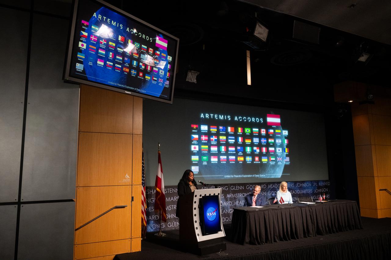 U.S. Department of State Acting Assistant Secretary in the Bureau of Oceans and International Environmental and Scientific Affairs Jennifer R. Littlejohn delivers remarks as NASA Administrator Bill Nelson and Ambassador of the Republic of Austria to the United States of America Petra Schneebauer look on during an Artemis Accords signing ceremony, Wednesday, Dec. 11, 2024, at the Mary W. Jackson NASA Headquarters building in Washington. The Republic of Austria is the 50th country to sign the Artemis Accords, which establish a practical set of principles to guide space exploration cooperation among nations participating in NASA’s Artemis program. Photo Credit: (NASA/Joel Kowsky)