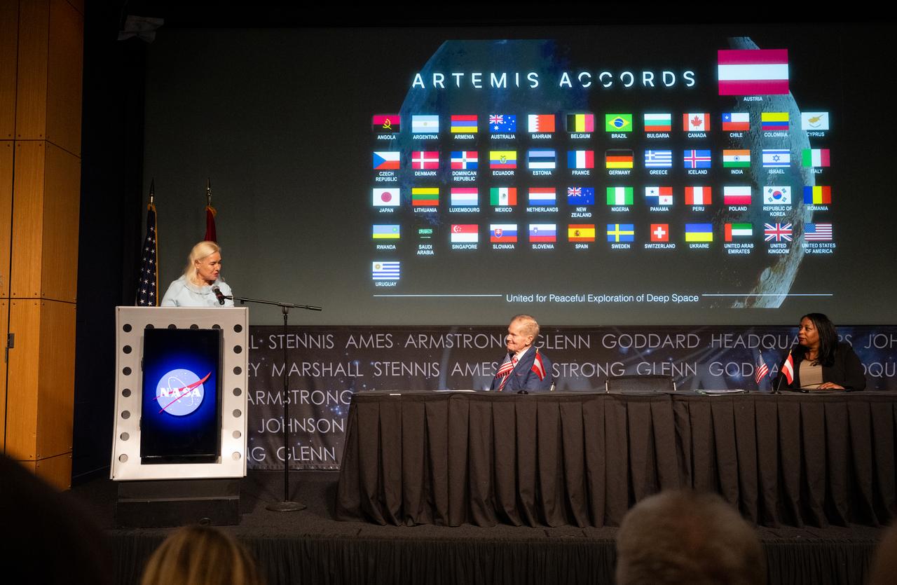 Ambassador of the Republic of Austria to the United States of America Petra Schneebauer delivers remarks as NASA Administrator Bill Nelson and U.S. Department of State Acting Assistant Secretary in the Bureau of Oceans and International Environmental and Scientific Affairs Jennifer R. Littlejohn look on during an Artemis Accords signing ceremony, Wednesday, Dec. 11, 2024, at the Mary W. Jackson NASA Headquarters building in Washington. The Republic of Austria is the 50th country to sign the Artemis Accords, which establish a practical set of principles to guide space exploration cooperation among nations participating in NASA’s Artemis program. Photo Credit: (NASA/Joel Kowsky)
