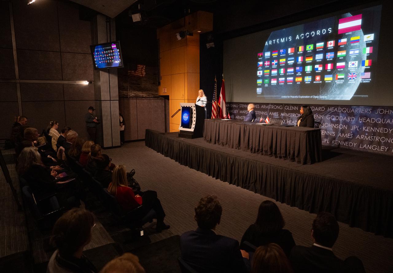 Ambassador of the Republic of Austria to the United States of America Petra Schneebauer delivers remarks as NASA Administrator Bill Nelson and U.S. Department of State Acting Assistant Secretary in the Bureau of Oceans and International Environmental and Scientific Affairs Jennifer R. Littlejohn look on during an Artemis Accords signing ceremony, Wednesday, Dec. 11, 2024, at the Mary W. Jackson NASA Headquarters building in Washington. The Republic of Austria is the 50th country to sign the Artemis Accords, which establish a practical set of principles to guide space exploration cooperation among nations participating in NASA’s Artemis program. Photo Credit: (NASA/Joel Kowsky)