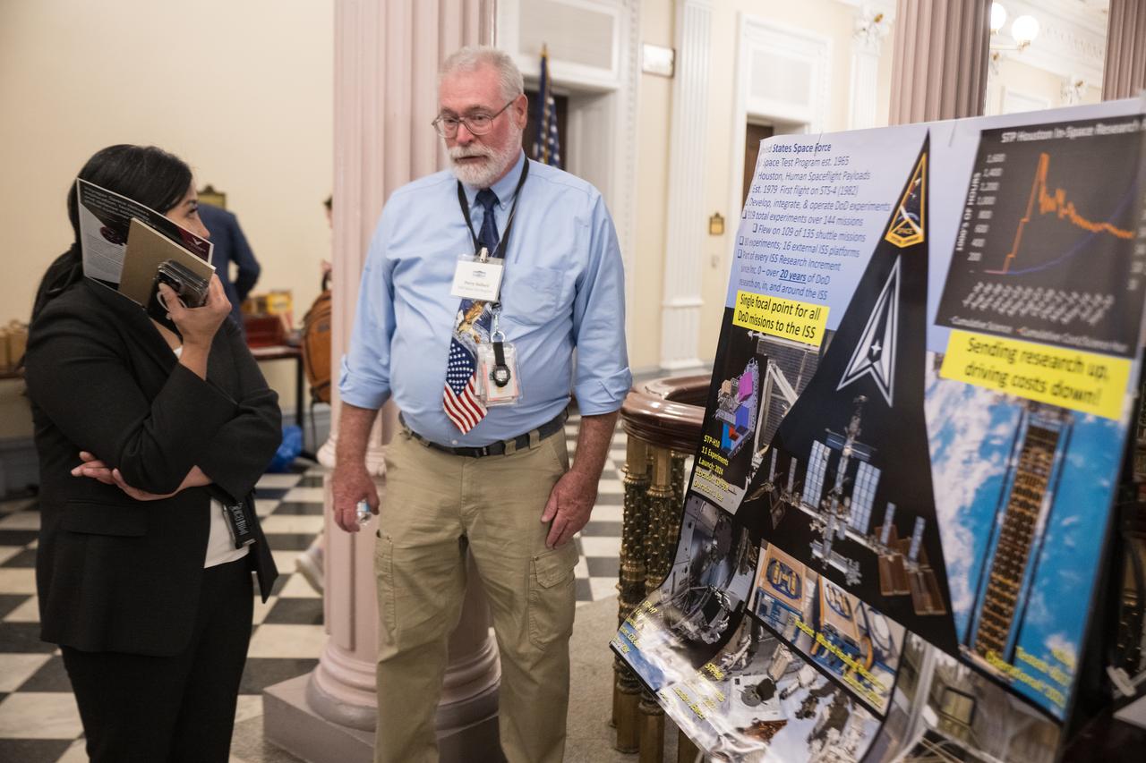 Exhibitors discuss research conducted in microgravity at the Microgravity Science Summit at the Eisenhower Executive Office Building, Monday, Dec. 13, 2024 in Washington. Photo Credit: (NASA/Aubrey Gemignani)