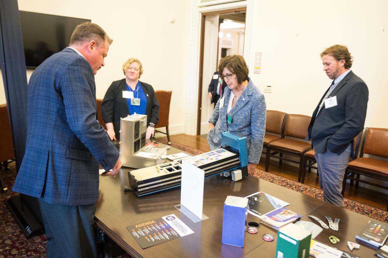 NASA's Director of the International Space Station and Commercial Spaceflight Divisions, Robyn Gates, views hardware used in microgravity at the Microgravity Science Summit at the Eisenhower Executive Office Building, Monday, Dec. 13, 2024 in Washington. Photo Credit: (NASA/Aubrey Gemignani)