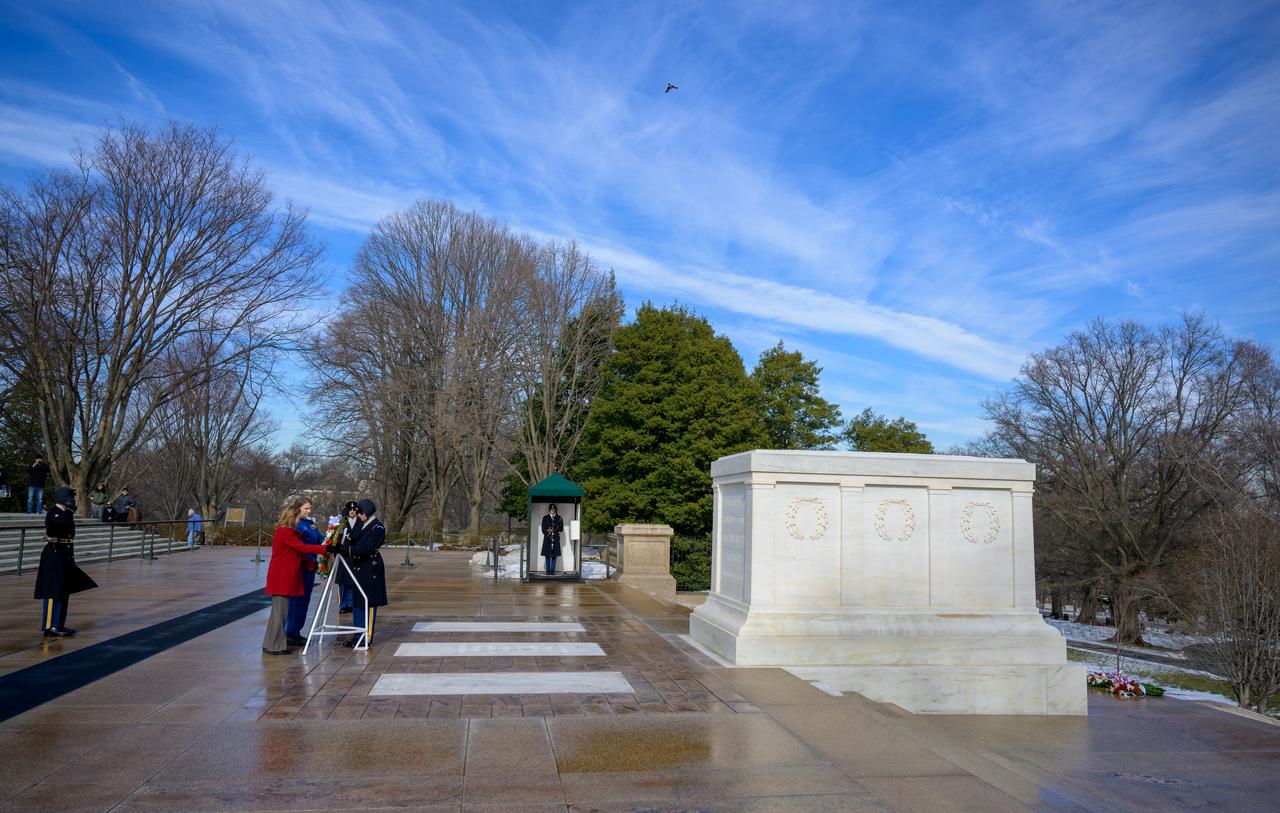 NASA personnel watch as a wreath is laid at the Tomb of the Unknowns by NASA acting Administrator Janet Petro, left, and NASA Astronaut Kayla Barron, as part of NASA's Day of Remembrance, Thursday, Jan. 23, 2025, at Arlington National Cemetery in Arlington, Va. The wreaths were laid in memory of those men and women who lost their lives in the quest for space exploration. Photo Credit: (NASA/Bill Ingalls)