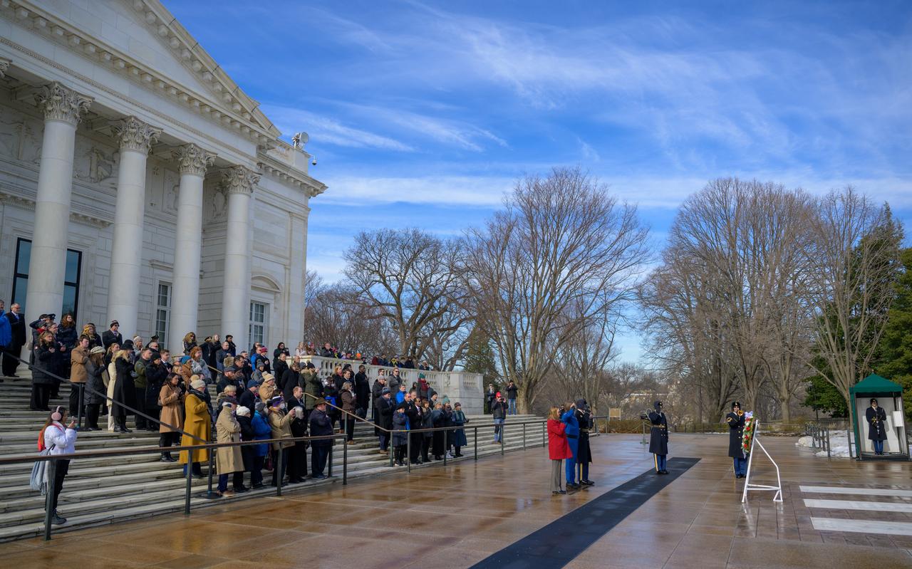 NASA personnel watch as a wreath is laid at the Tomb of the Unknowns by NASA acting Administrator Janet Petro, left, and NASA Astronaut Kayla Barron, as part of NASA's Day of Remembrance, Thursday, Jan. 23, 2025, at Arlington National Cemetery in Arlington, Va. The wreaths were laid in memory of those men and women who lost their lives in the quest for space exploration. Photo Credit: (NASA/Bill Ingalls)