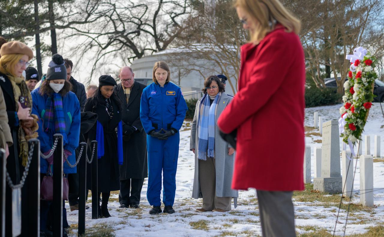 NASA Astronaut Kayla Barron, and other guest, bow their heads during a ceremony as part of NASA's Day of Remembrance, Thursday, Jan. 23, 2025, at Arlington National Cemetery in Arlington, Va. The wreaths were laid in memory of those men and women who lost their lives in the quest for space exploration. Photo Credit: (NASA/Bill Ingalls)