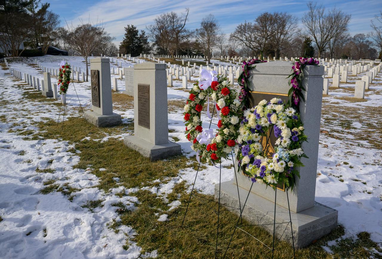 The Space Shuttle Columbia Memorial, foreground, and the Space Shuttle Challenger Memorial, background, are seen during a wreath laying ceremony that was part of NASA's Day of Remembrance, Thursday, Jan. 23, 2025, at Arlington National Cemetery in Arlington, Va. Wreaths were laid in memory of those men and women who lost their lives in the quest for space exploration.  Photo Credit: (NASA/Bill Ingalls)