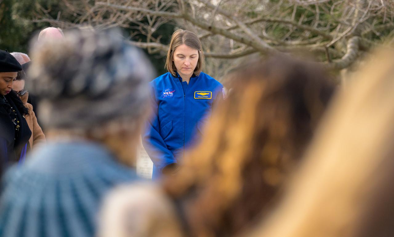 NASA Astronaut Kayla Barron is seen during a moment of silence at the Apollo 1 monument as part of NASA's Day of Remembrance, Thursday, Jan. 23, 2025, at Arlington National Cemetery in Arlington, Va. The monument honors and memorializes the Apollo 1 crew of Virgil I. “Gus” Grissom, Edward H. White II, and Roger B. Chaffee. Photo Credit: (NASA/Bill Ingalls)