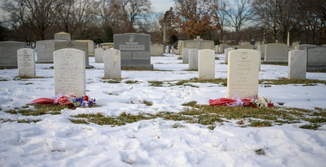 The Apollo 1 grave sites of Virgil I. “Gus” Grissom, and Roger B. Chaffee are seen with flowers as part of NASA's Day of Remembrance, Thursday, Jan. 23, 2025, at Arlington National Cemetery in Arlington, Va. Photo Credit: (NASA/Bill Ingalls)