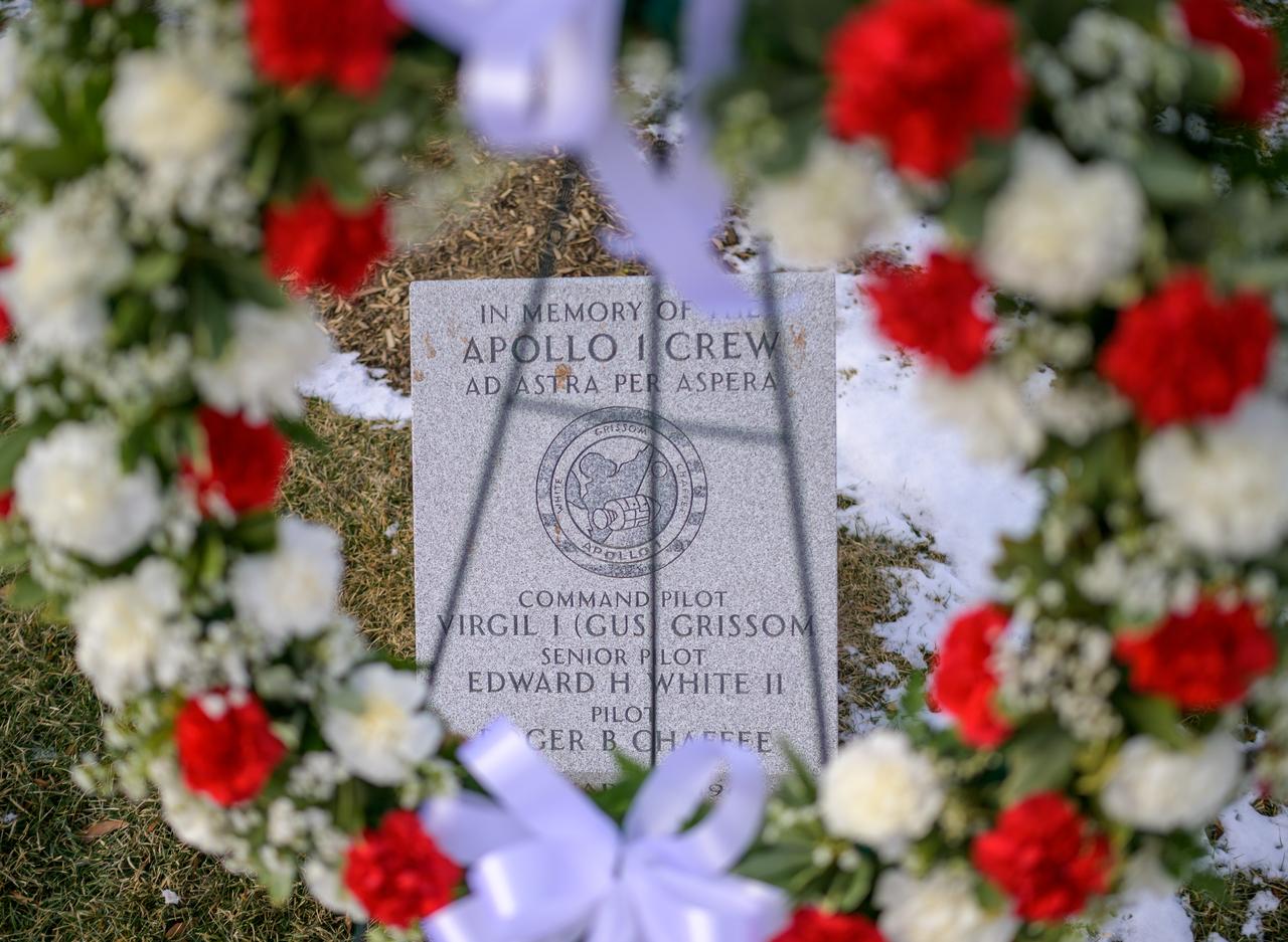 A wreath is left at the Apollo 1 monument as part of NASA's Day of Remembrance, Thursday, Jan. 23, 2025, at Arlington National Cemetery in Arlington, Va. The monument honors and memorializes the Apollo 1 crew of Virgil I. “Gus” Grissom, Edward H. White II, and Roger B. Chaffee. Photo Credit: (NASA/Bill Ingalls)