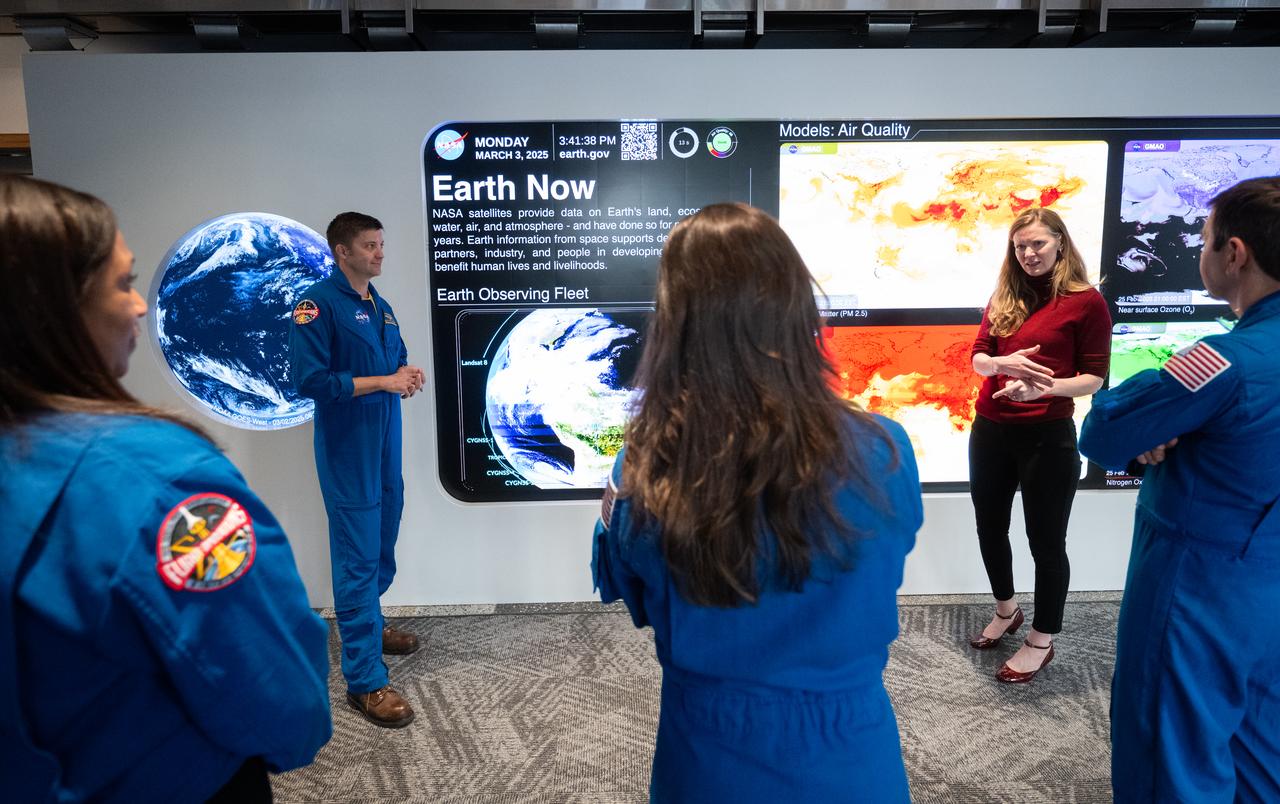 Eleanor Stokes, program manger for NASA’s Earth Information Center, second from right, speaks with Expedition 71 NASA astronauts Michael Barratt, Tracy Dyson, Jeanette Epps, and Matthew Dominick during a tour of the Earth Information Center, Monday, March 3, 2025, at the Mary W. Jackson NASA Headquarters building in Washington. Dominick, Epps, Barratt, and Dyson served as part of Expedition 71 aboard the International Space Station. Photo Credit: (NASA/Joel Kowsky)