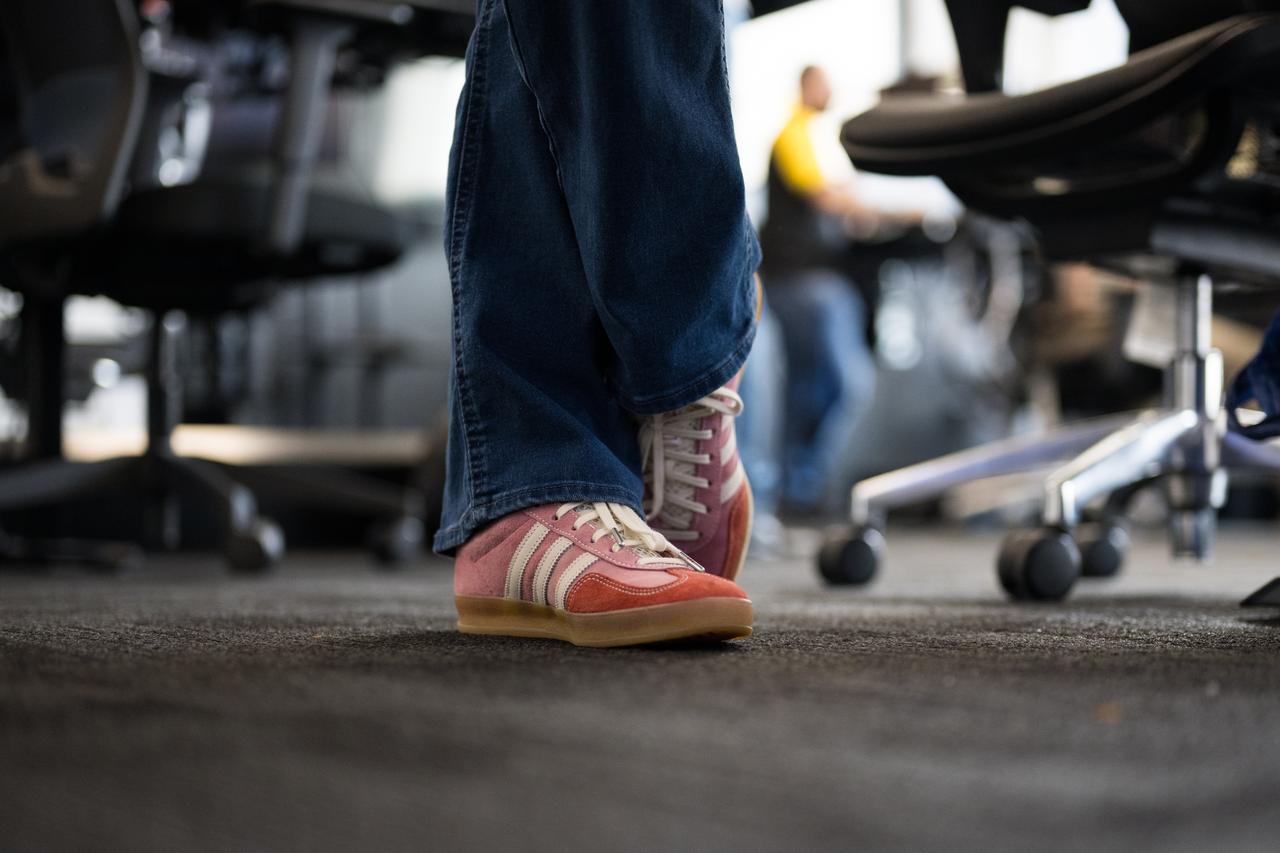 The shoes of Nicole Jordan, NASA operations manager for the Commercial Crew Program are seen as she monitors the countdown during a dress rehearsal in preparation for the launch of a SpaceX Falcon 9 rocket carrying the company's Dragon spacecraft on NASA’s SpaceX Crew-10 mission with NASA astronauts Anne McClain and Nichole Ayers, JAXA (Japan Aerospace Exploration Agency) astronaut Takuya Onishi, and Roscosmos cosmonaut Kirill Peskov onboard, Sunday, March 9, 2025, in the control room of SpaceX’s HangarX at NASA’s Kennedy Space Center in Florida. NASA’s SpaceX Crew-10 mission is the tenth crew rotation mission of the SpaceX Dragon spacecraft and Falcon 9 rocket to the International Space Station as part of the agency’s Commercial Crew Program. McClain, Ayers, Onishi, and Peskov are scheduled to launch at 7:48 p.m. EDT on Wednesday, March 12, from Launch Complex 39A at the NASA's Kennedy Space Center. Photo Credit: (NASA/Aubrey Gemignani)