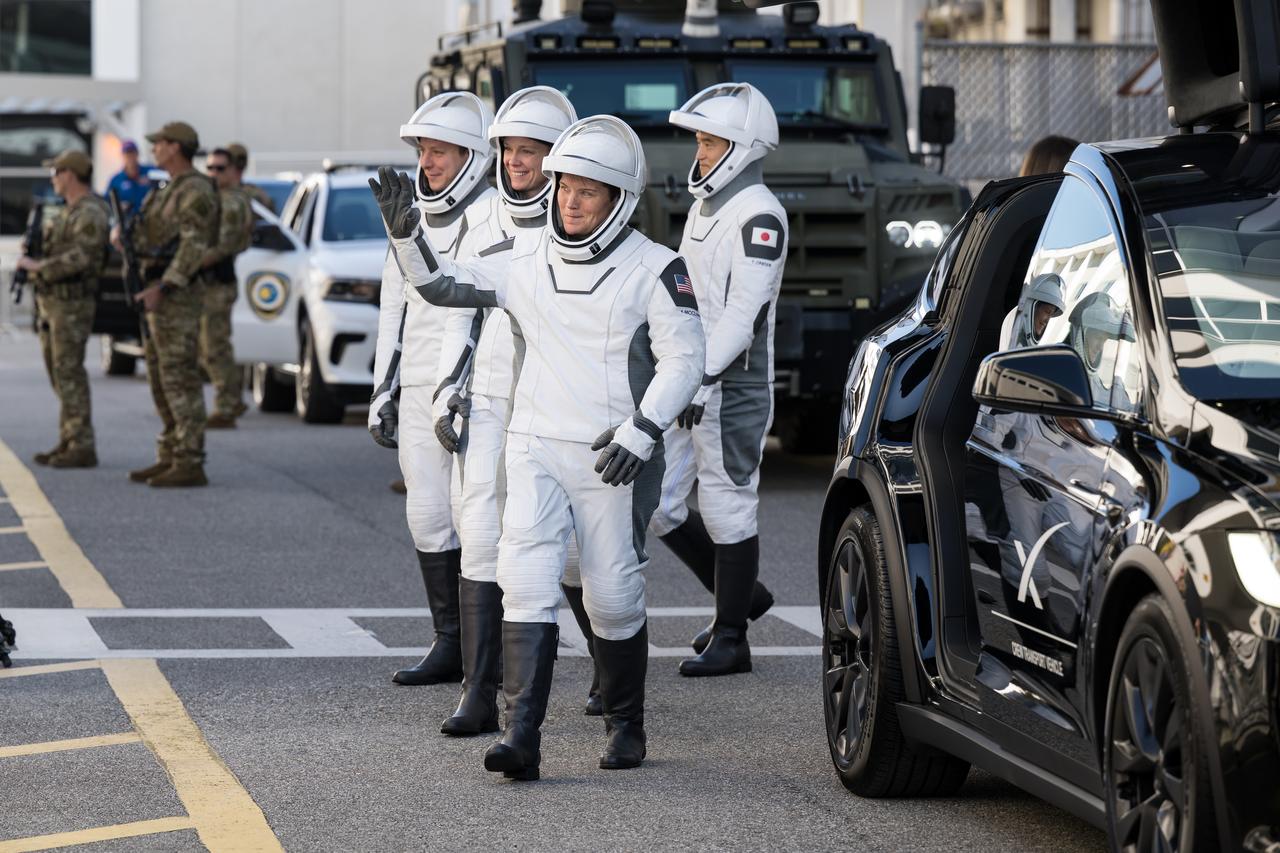 NASA astronauts Anne McClain and Nichole Ayers, JAXA (Japan Aerospace Exploration Agency) astronaut Takuya Onishi, and Roscosmos cosmonaut Kirill Peskov, wearing SpaceX spacesuits, are seen as they prepare to depart the Neil A. Armstrong Operations and Checkout Building for Launch Complex 39A on NASA's Kennedy Space Center to board the SpaceX Dragon spacecraft for the Crew-10 mission launch, Wednesday, March 12, 2025, at NASA’s Kennedy Space Center in Florida. NASA’s SpaceX Crew-10 mission is the tenth crew rotation mission of the SpaceX Crew Dragon spacecraft and Falcon 9 rocket to the International Space Station as part of the agency’s Commercial Crew Program. McClain, Ayers, Onishi, and Peskov are scheduled to launch at 7:48 p.m. EDT, from Launch Complex 39A at the NASA's Kennedy Space Center. Photo Credit: (NASA/Aubrey Gemignani)