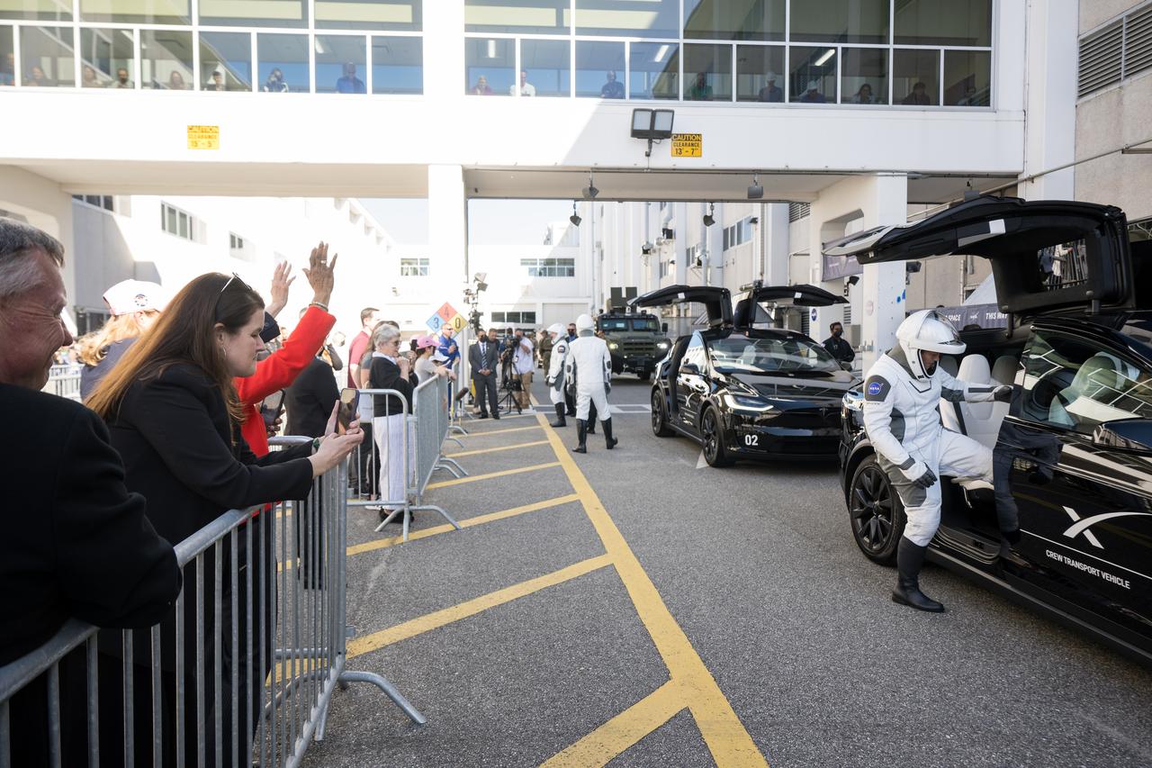 NASA astronauts Anne McClain and Nichole Ayers, JAXA (Japan Aerospace Exploration Agency) astronaut Takuya Onishi, and Roscosmos cosmonaut Kirill Peskov, wearing SpaceX spacesuits, are seen as they prepare to depart the Neil  A. Armstrong Operations and Checkout Building for Launch Complex 39A on NASA's Kennedy Space Center to board the SpaceX Dragon spacecraft for the Crew-10 mission launch, Wednesday, March 12, 2025, at NASA’s Kennedy Space Center in Florida. NASA’s SpaceX Crew-10 mission is the tenth crew rotation mission of the SpaceX Crew Dragon spacecraft and Falcon 9 rocket to the International Space Station as part of the agency’s Commercial Crew Program. McClain, Ayers, Onishi, and Peskov are scheduled to launch at 7:48 p.m. EDT, from Launch Complex 39A at the NASA's Kennedy Space Center.  Photo Credit: (NASA/Aubrey Gemignani)