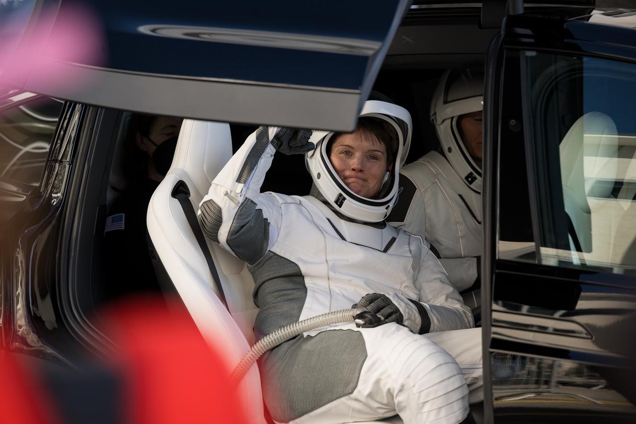 NASA astronaut Anne McClain gestures to family and friends as she and crewmates NASA astronaut Nichole Ayers, JAXA (Japan Aerospace Exploration Agency) astronaut Takuya Onishi, and Roscosmos cosmonaut Kirill Peskov, prepare to depart the Neil  A. Armstrong Operations and Checkout Building for Launch Complex 39A on NASA's Kennedy Space Center to board the SpaceX Dragon spacecraft for the Crew-10 mission launch, Wednesday, March 12, 2025, at NASA’s Kennedy Space Center in Florida. NASA’s SpaceX Crew-10 mission is the tenth crew rotation mission of the SpaceX Crew Dragon spacecraft and Falcon 9 rocket to the International Space Station as part of the agency’s Commercial Crew Program. McClain, Ayers, Onishi, and Peskov are scheduled to launch at 7:48 p.m. EDT, from Launch Complex 39A at the NASA's Kennedy Space Center.  Photo Credit: (NASA/Aubrey Gemignani)