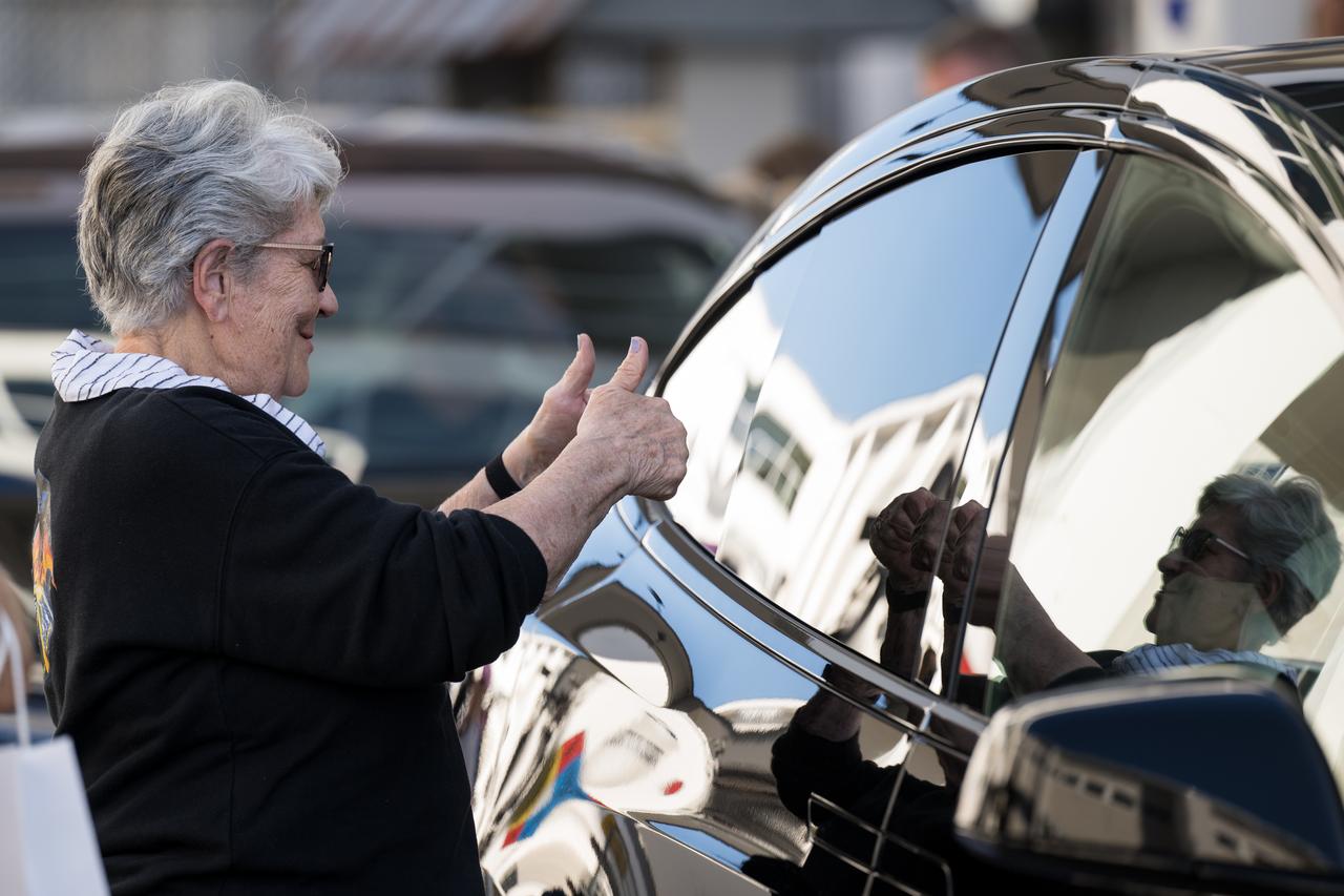 Family and friends gesture through the car window to NASA astronauts Anne McClain and Nichole Ayers,  as they prepare to depart the Neil  A. Armstrong Operations and Checkout Building for Launch Complex 39A on NASA's Kennedy Space Center to board the SpaceX Dragon spacecraft for the Crew-10 mission launch, Wednesday, March 12, 2025, at NASA’s Kennedy Space Center in Florida. NASA’s SpaceX Crew-10 mission is the tenth crew rotation mission of the SpaceX Crew Dragon spacecraft and Falcon 9 rocket to the International Space Station as part of the agency’s Commercial Crew Program. McClain, Ayers, JAXA (Japan Aerospace Exploration Agency) astronaut Takuya Onishi, and Roscosmos cosmonaut Kirill Peskov, are scheduled to launch at 7:48 p.m. EDT, from Launch Complex 39A at the NASA's Kennedy Space Center.  Photo Credit: (NASA/Aubrey Gemignani)