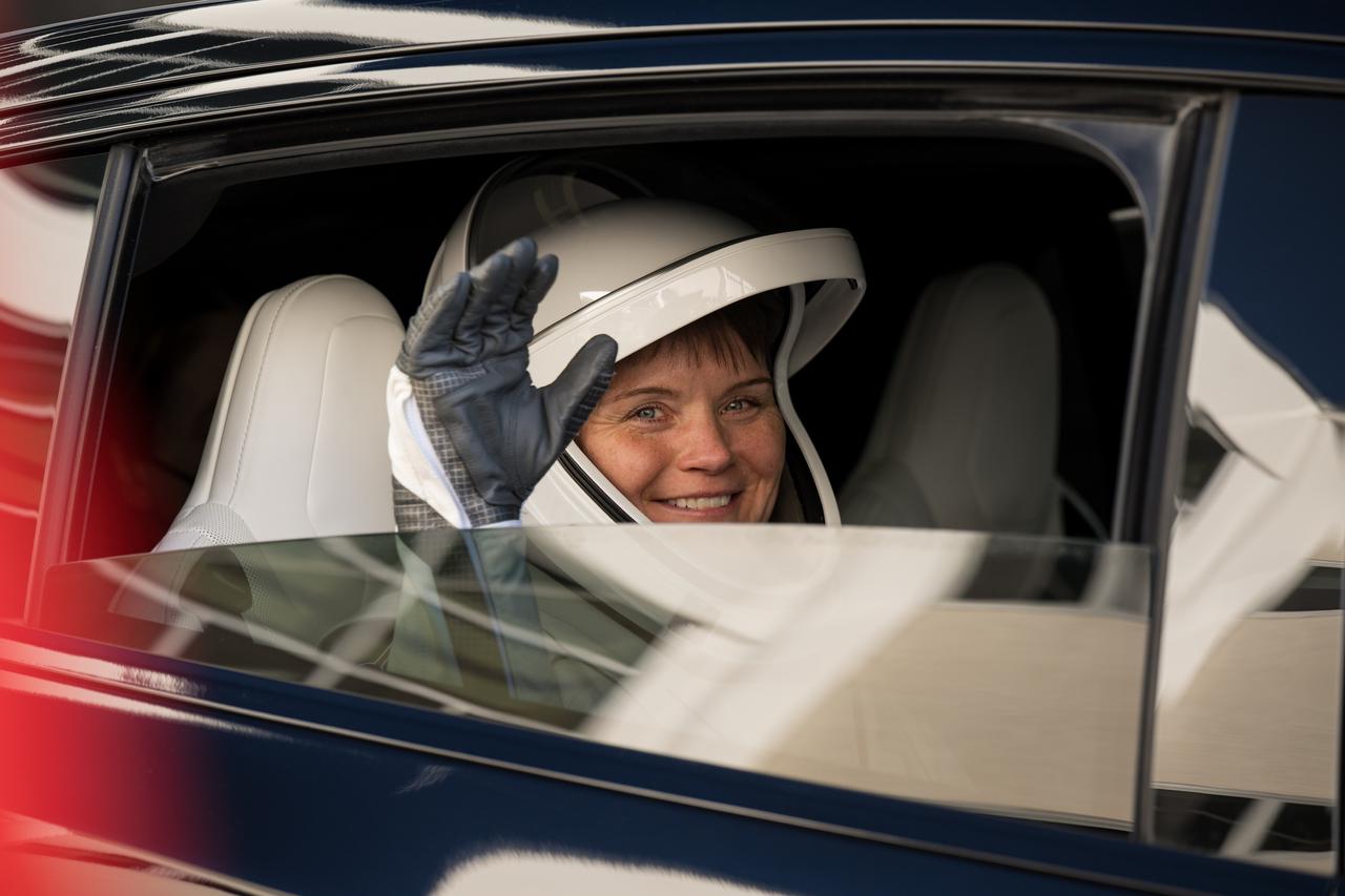 NASA astronaut Anne McClain waves as she and crewmates NASA astronaut Nichole Ayers, JAXA (Japan Aerospace Exploration Agency) astronaut Takuya Onishi, and Roscosmos cosmonaut Kirill Peskov depart the Neil  A. Armstrong Operations and Checkout Building for Launch Complex 39A on NASA's Kennedy Space Center to board the SpaceX Dragon spacecraft for the Crew-10 mission launch, Wednesday, March 12, 2025, at NASA’s Kennedy Space Center in Florida. NASA’s SpaceX Crew-10 mission is the tenth crew rotation mission of the SpaceX Crew Dragon spacecraft and Falcon 9 rocket to the International Space Station as part of the agency’s Commercial Crew Program. McClain, Ayers, Onishi, and Peskov are scheduled to launch at 7:48 p.m. EDT, from Launch Complex 39A at the NASA's Kennedy Space Center.  Photo Credit: (NASA/Aubrey Gemignani)