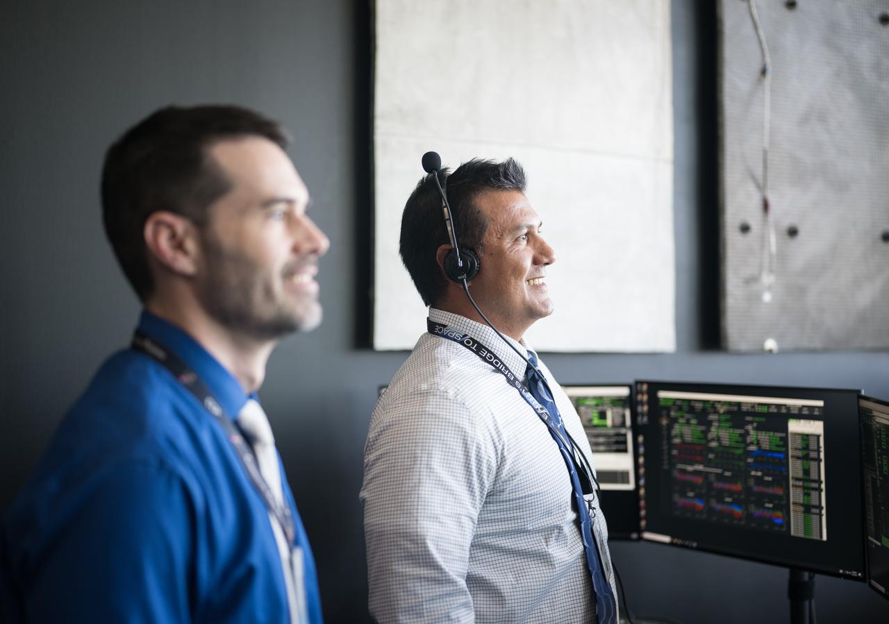 Dimitrios Mitsakos, NASA Integrated Performance Chief Engineer, and John Posey, lead engineer for Dragon in NASA's Commercial Crew Program, monitor the launch of a SpaceX Falcon 9 rocket carrying the company's Dragon spacecraft on the Crew-10 mission with NASA astronauts Anne McClain and Nichole Ayers, JAXA (Japan Aerospace Exploration Agency) astronaut Takuya Onishi, and Roscosmos cosmonaut Kirill Peskov onboard, Friday, March 14, 2025, in the control room of SpaceX’s HangarX at NASA’s Kennedy Space Center in Florida. NASA’s SpaceX Crew-10 mission is the tenth crew rotation mission of the SpaceX Dragon spacecraft and Falcon 9 rocket to the International Space Station as part of the agency’s Commercial Crew Program. McClain, Ayers, Onishi, and Peskov launched at 7:03 p.m. EDT, from Launch Complex 39A at the Kennedy Space Center. Photo Credit: (NASA/Aubrey Gemignani)