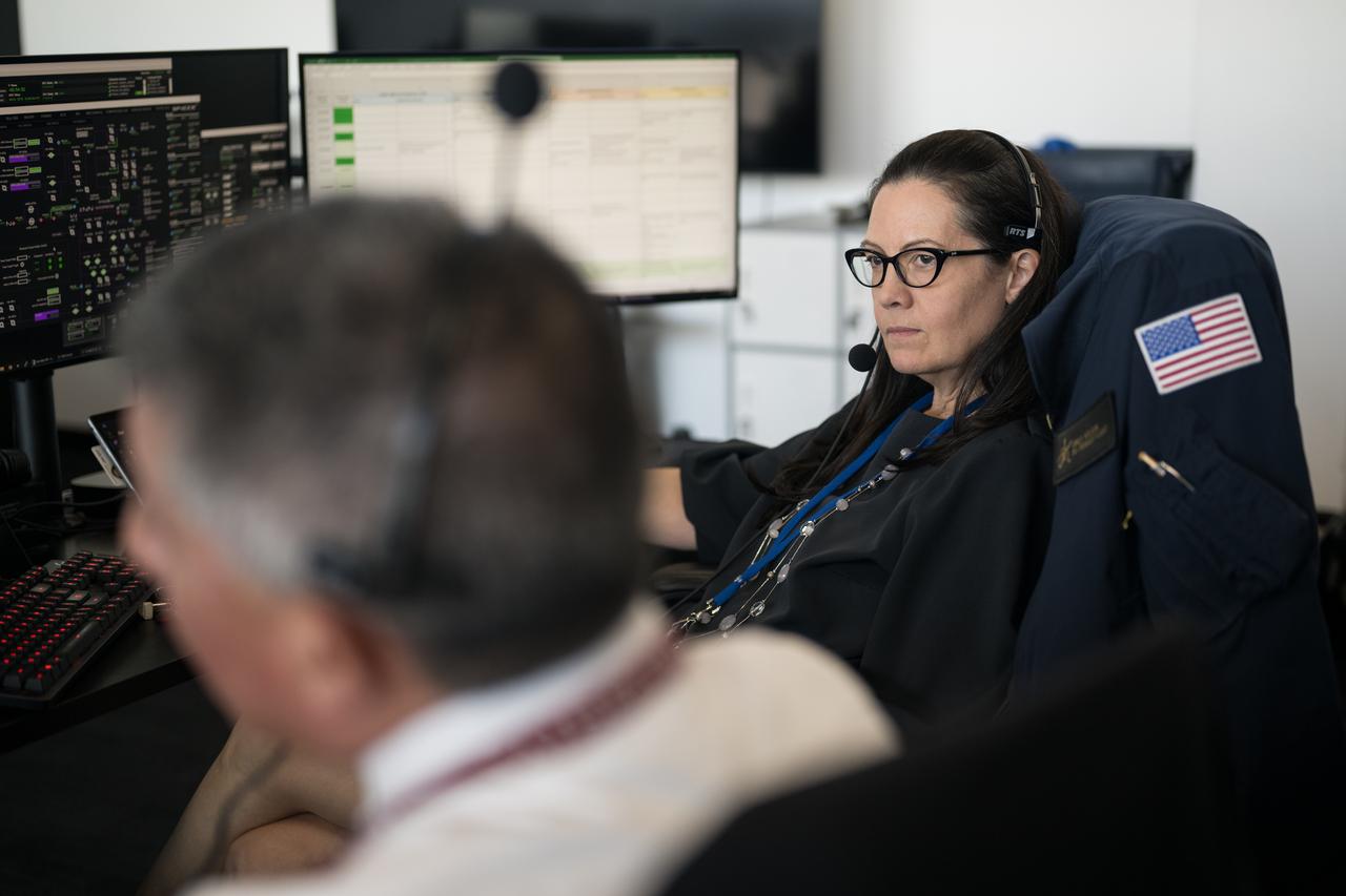 Emily Nelson, NASA's chief flight director, monitors the launch of a SpaceX Falcon 9 rocket carrying the company's Dragon spacecraft on the Crew-10 mission with NASA astronauts Anne McClain and Nichole Ayers, JAXA (Japan Aerospace Exploration Agency) astronaut Takuya Onishi, and Roscosmos cosmonaut Kirill Peskov onboard, Friday, March 14, 2025, in the control room of SpaceX’s HangarX at NASA’s Kennedy Space Center in Florida. NASA’s SpaceX Crew-10 mission is the tenth crew rotation mission of the SpaceX Dragon spacecraft and Falcon 9 rocket to the International Space Station as part of the agency’s Commercial Crew Program. McClain, Ayers, Onishi, and Peskov launched at 7:03 p.m. EDT, from Launch Complex 39A at the Kennedy Space Center. Photo Credit: (NASA/Aubrey Gemignani)