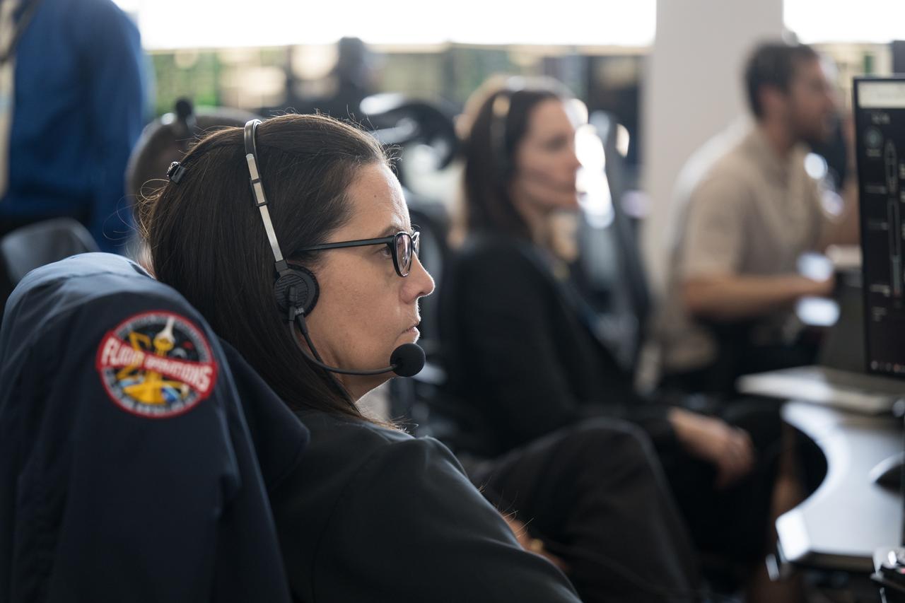Emily Nelson, NASA's chief flight director, monitors the launch of a SpaceX Falcon 9 rocket carrying the company's Dragon spacecraft on the Crew-10 mission with NASA astronauts Anne McClain and Nichole Ayers, JAXA (Japan Aerospace Exploration Agency) astronaut Takuya Onishi, and Roscosmos cosmonaut Kirill Peskov onboard, Friday, March 14, 2025, in the control room of SpaceX’s HangarX at NASA’s Kennedy Space Center in Florida. NASA’s SpaceX Crew-10 mission is the tenth crew rotation mission of the SpaceX Dragon spacecraft and Falcon 9 rocket to the International Space Station as part of the agency’s Commercial Crew Program. McClain, Ayers, Onishi, and Peskov launched at 7:03 p.m. EDT, from Launch Complex 39A at the Kennedy Space Center. Photo Credit: (NASA/Aubrey Gemignani)