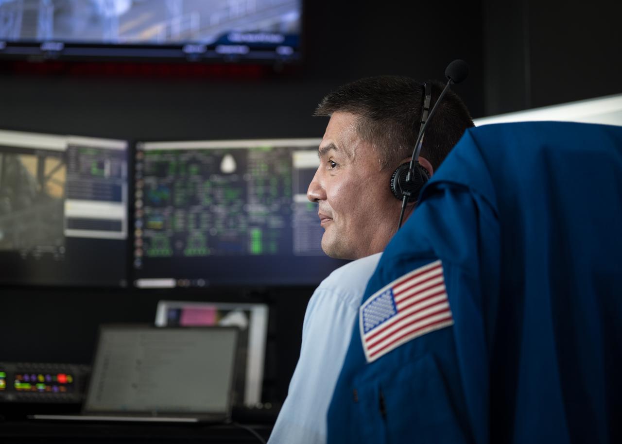 NASA astronaut Kjell Lindgren, monitors the launch of a SpaceX Falcon 9 rocket carrying the company's Dragon spacecraft on the Crew-10 mission with NASA astronauts Anne McClain and Nichole Ayers, JAXA (Japan Aerospace Exploration Agency) astronaut Takuya Onishi, and Roscosmos cosmonaut Kirill Peskov onboard, Friday, March 14, 2025, in the control room of SpaceX’s HangarX at NASA’s Kennedy Space Center in Florida. NASA’s SpaceX Crew-10 mission is the tenth crew rotation mission of the SpaceX Dragon spacecraft and Falcon 9 rocket to the International Space Station as part of the agency’s Commercial Crew Program. McClain, Ayers, Onishi, and Peskov launched at 7:03 p.m. EDT, from Launch Complex 39A at the Kennedy Space Center. Photo Credit: (NASA/Aubrey Gemignani)