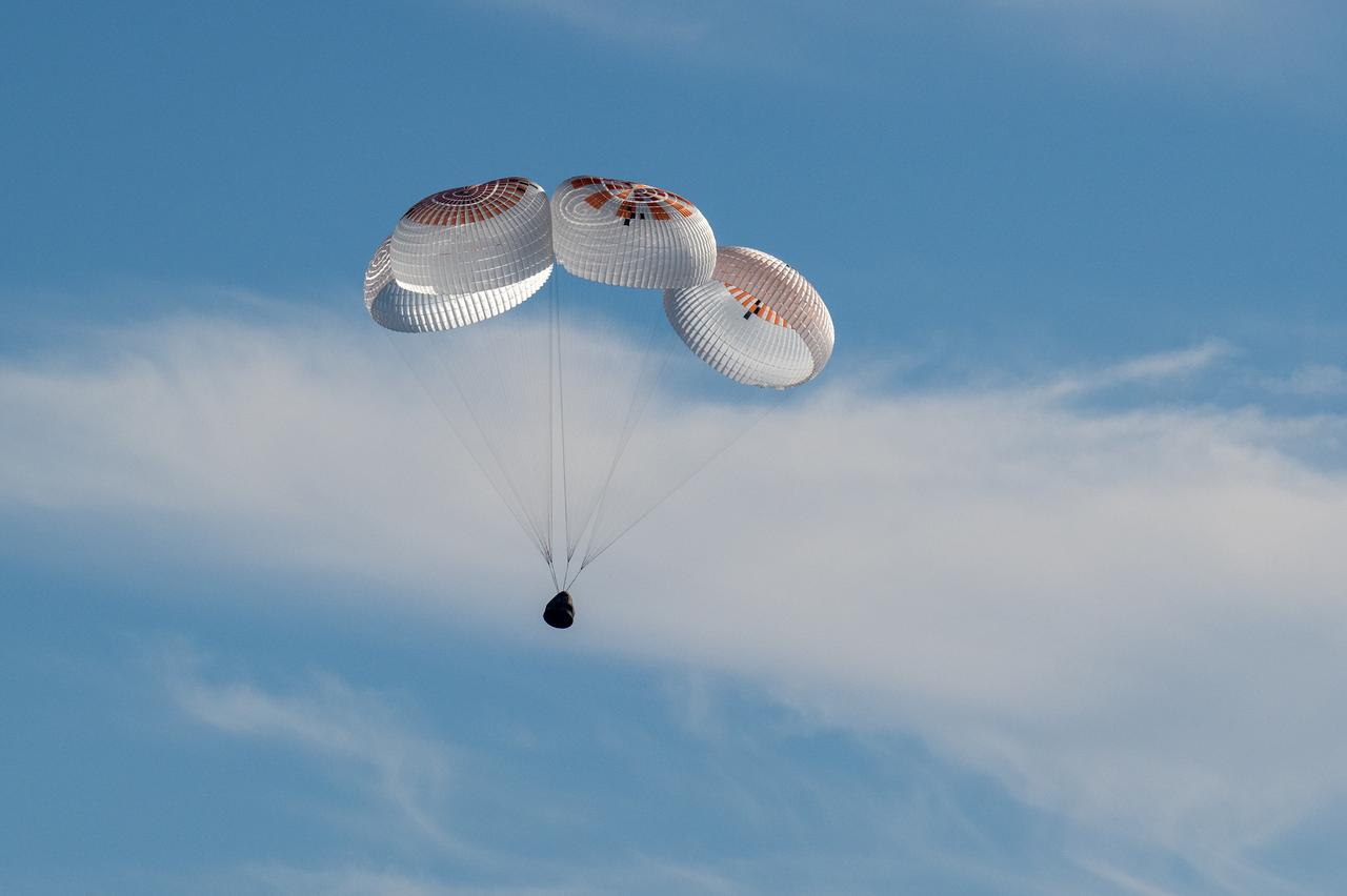 A SpaceX Dragon spacecraft is seen as it lands with NASA astronauts Nick Hague, Suni Williams, Butch Wilmore, and Roscosmos cosmonaut Aleksandr Gorbunov aboard in the water off the coast of Tallahassee, Florida, Tuesday, March 18, 2025. Hague, Gorbunov, Williams, and Wilmore are returning from a long-duration science expedition aboard the International Space Station. Photo Credit: (NASA/Keegan Barber)