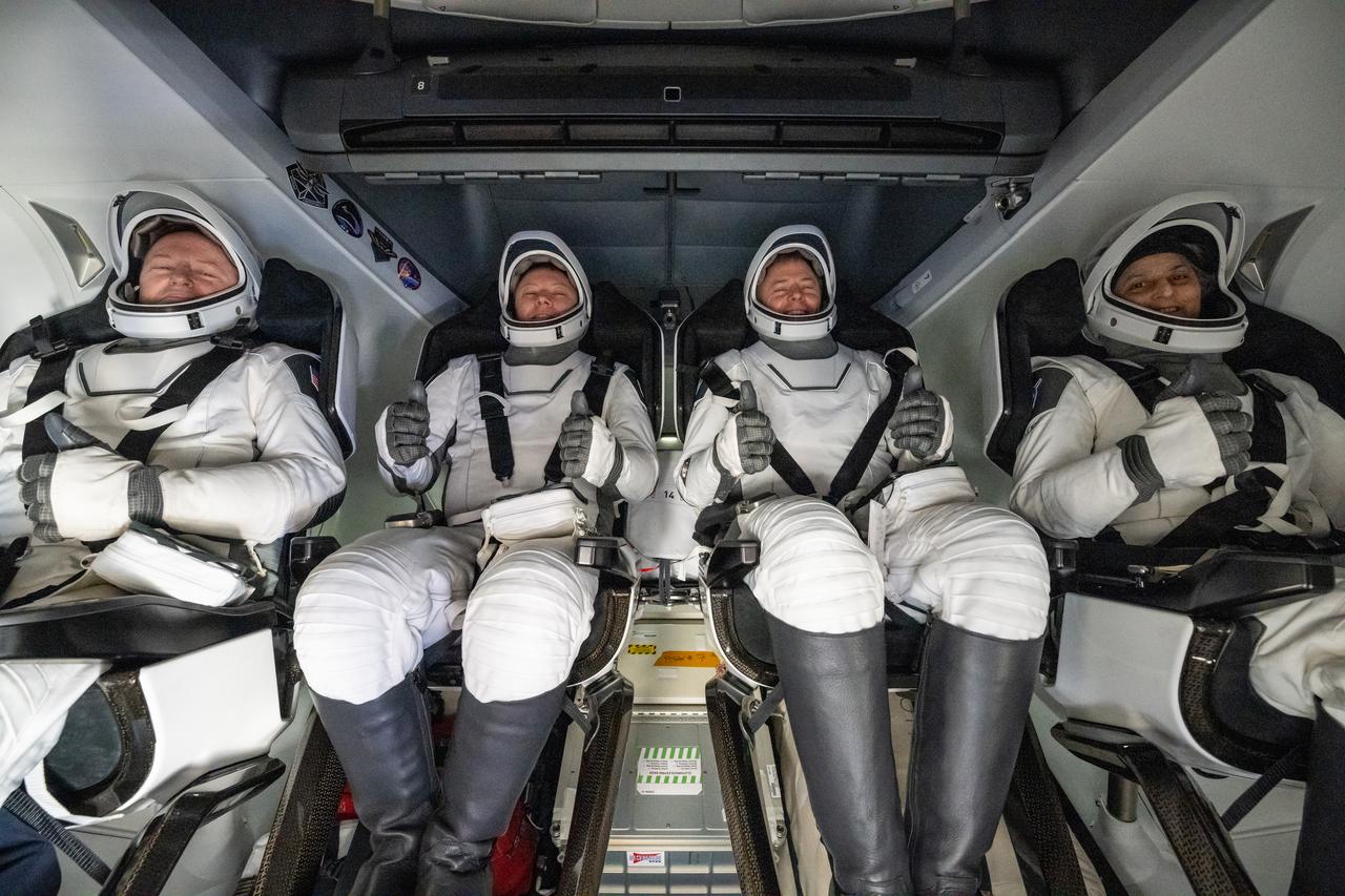 NASA astronaut Butch Wilmore, left, Roscosmos cosmonaut Aleksandr Gorbunov, second from left, and NASA astronauts Nick Hague, second from right, and Suni Williams, right are seen inside a SpaceX Dragon spacecraft onboard the SpaceX recovery ship MEGAN shortly after having landed in the water off the coast of Tallahassee, Florida, Tuesday, March 18, 2025. Hague, Gorbunov, Williams, and Wilmore are returning from a long-duration science expedition aboard the International Space Station. Photo Credit: (NASA/Keegan Barber)
