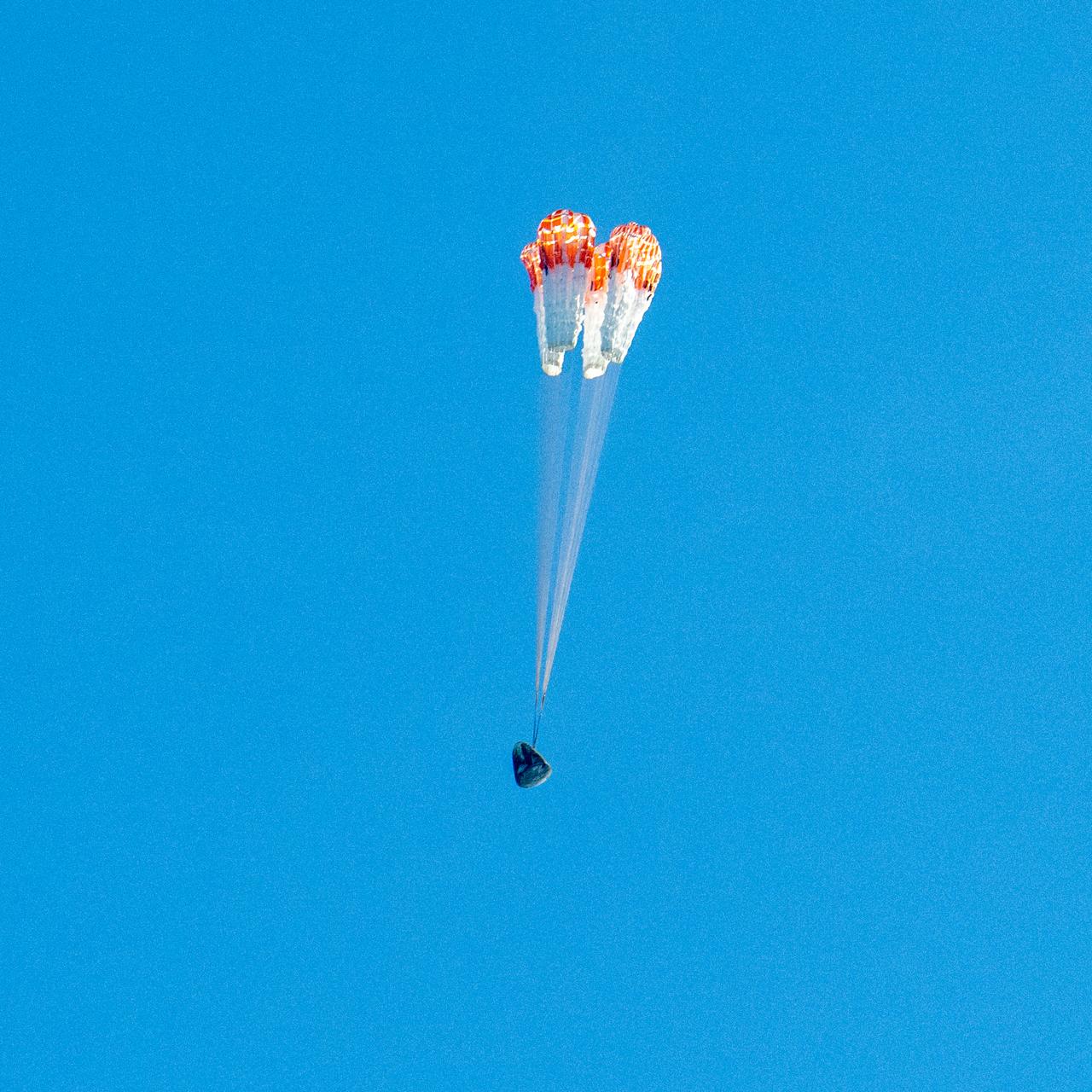 A SpaceX Dragon spacecraft is seen as it lands with NASA astronauts Nick Hague, Suni Williams, Butch Wilmore, and Roscosmos cosmonaut Aleksandr Gorbunov aboard in the water off the coast of Tallahassee, Florida, Tuesday, March 18, 2025. Hague, Gorbunov, Williams, and Wilmore are returning from a long-duration science expedition aboard the International Space Station. Photo Credit: (NASA/Keegan Barber)