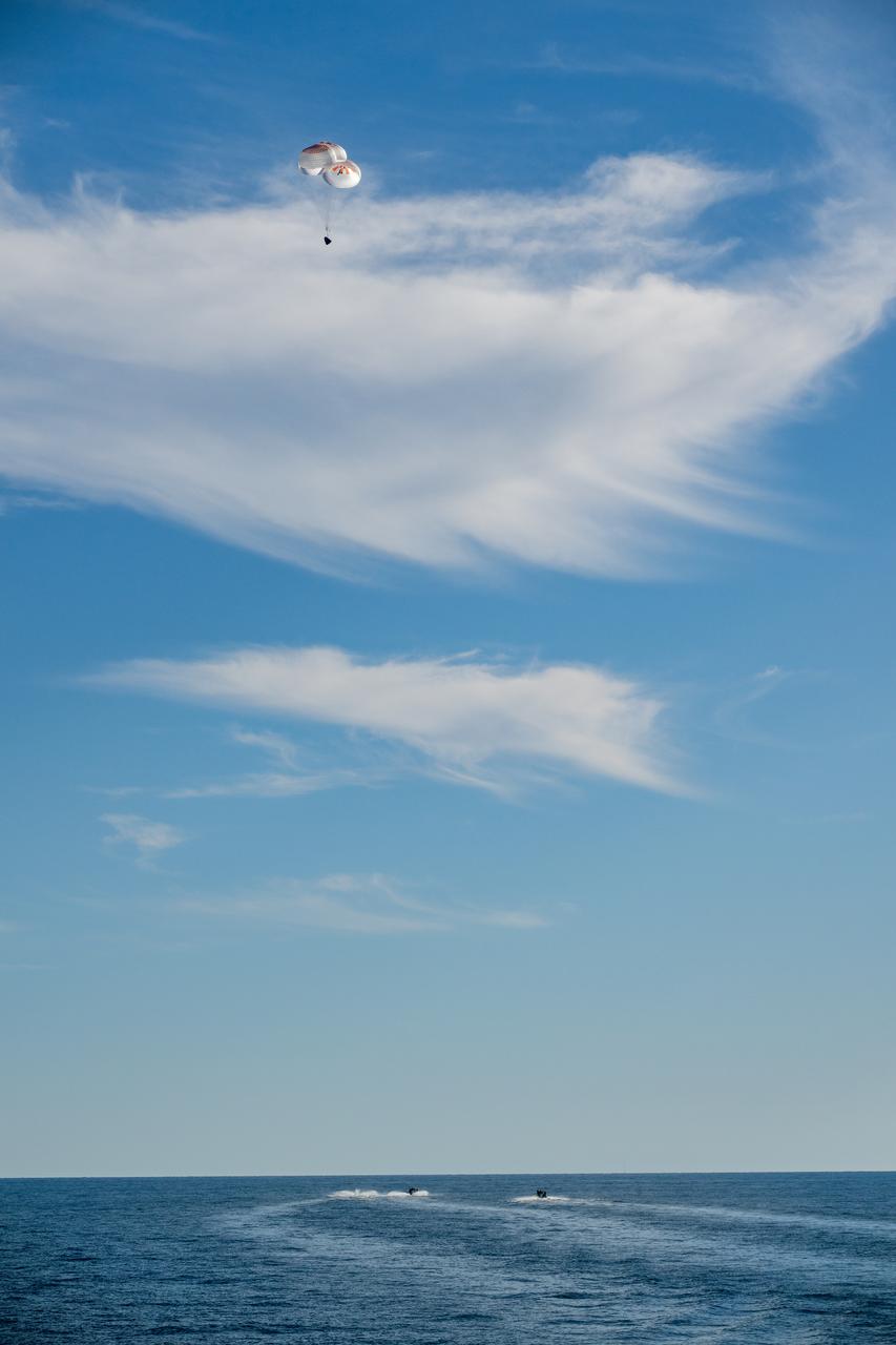 A SpaceX Dragon spacecraft is seen as it lands with NASA astronauts Nick Hague, Suni Williams, Butch Wilmore, and Roscosmos cosmonaut Aleksandr Gorbunov aboard in the water off the coast of Tallahassee, Florida, Tuesday, March 18, 2025. Hague, Gorbunov, Williams, and Wilmore are returning from a long-duration science expedition aboard the International Space Station. Photo Credit: (NASA/Keegan Barber)