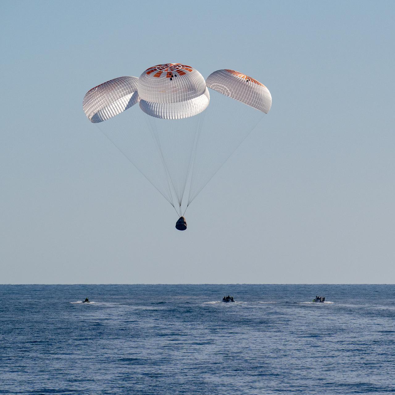 A SpaceX Dragon spacecraft is seen as it lands with NASA astronauts Nick Hague, Suni Williams, Butch Wilmore, and Roscosmos cosmonaut Aleksandr Gorbunov aboard in the water off the coast of Tallahassee, Florida, Tuesday, March 18, 2025. Hague, Gorbunov, Williams, and Wilmore are returning from a long-duration science expedition aboard the International Space Station. Photo Credit: (NASA/Keegan Barber)