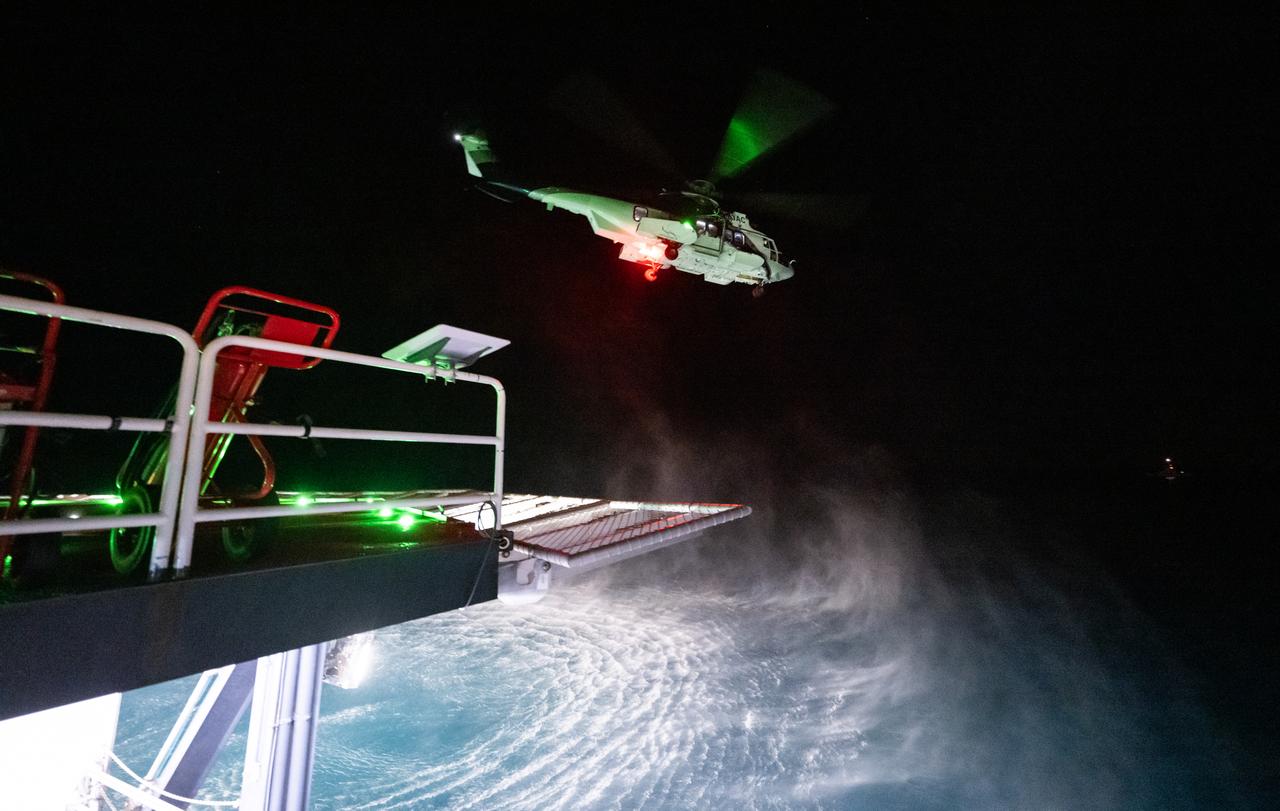 The helicopter carrying NASA astronauts Nick Hague, Suni Williams, Butch Wilmore, and Roscosmos cosmonaut Aleksandr Gorbunov takes off from the SpaceX recovery ship MEGAN off the coast of Tallahassee, Florida, Tuesday, March 18, 2025. Hague, Gorbunov, Williams, and Wilmore are returning from a long-duration science expedition aboard the International Space Station. Photo Credit: (NASA/Keegan Barber)
